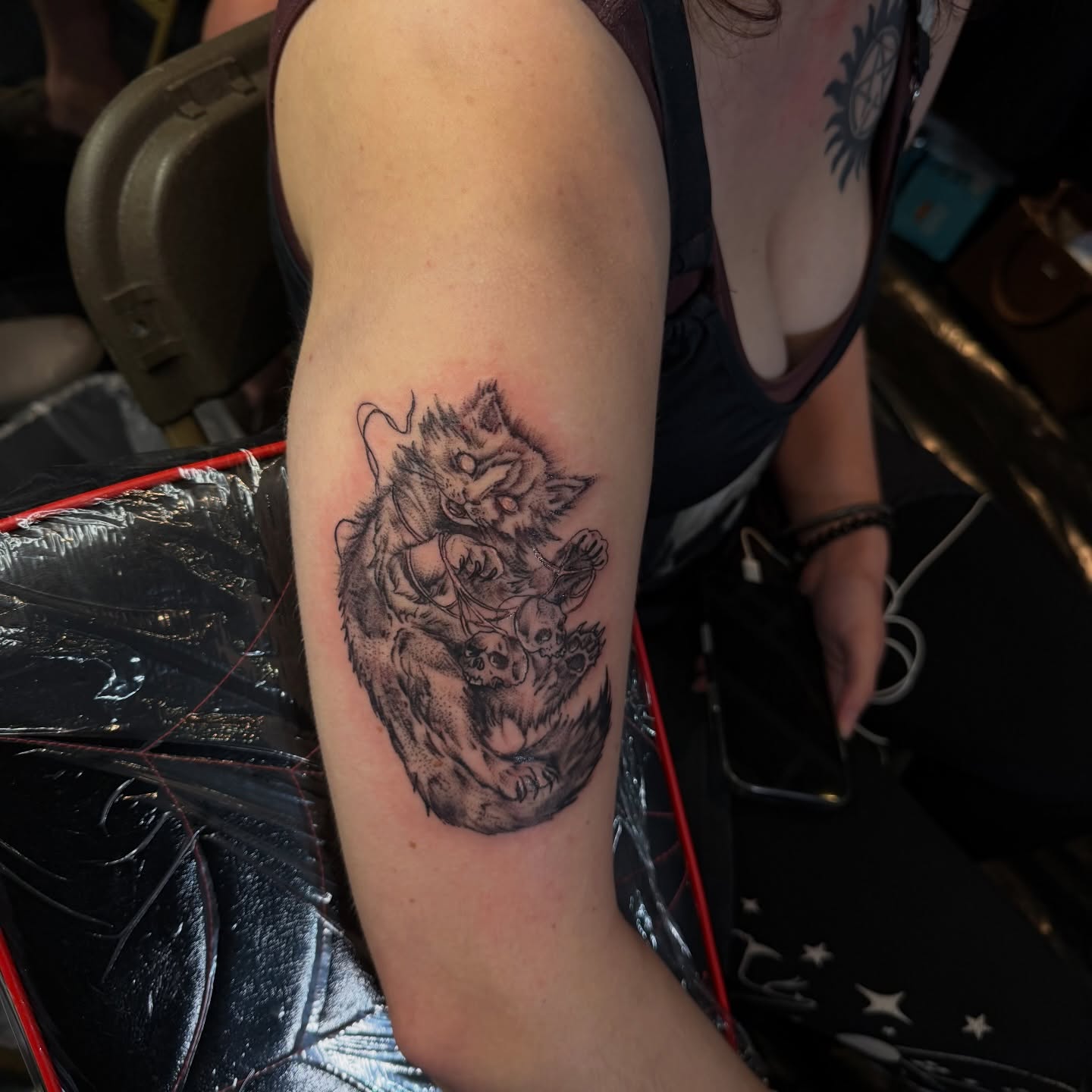 Cat and skull dotwork tattoo on the forearm by Nina Nichole