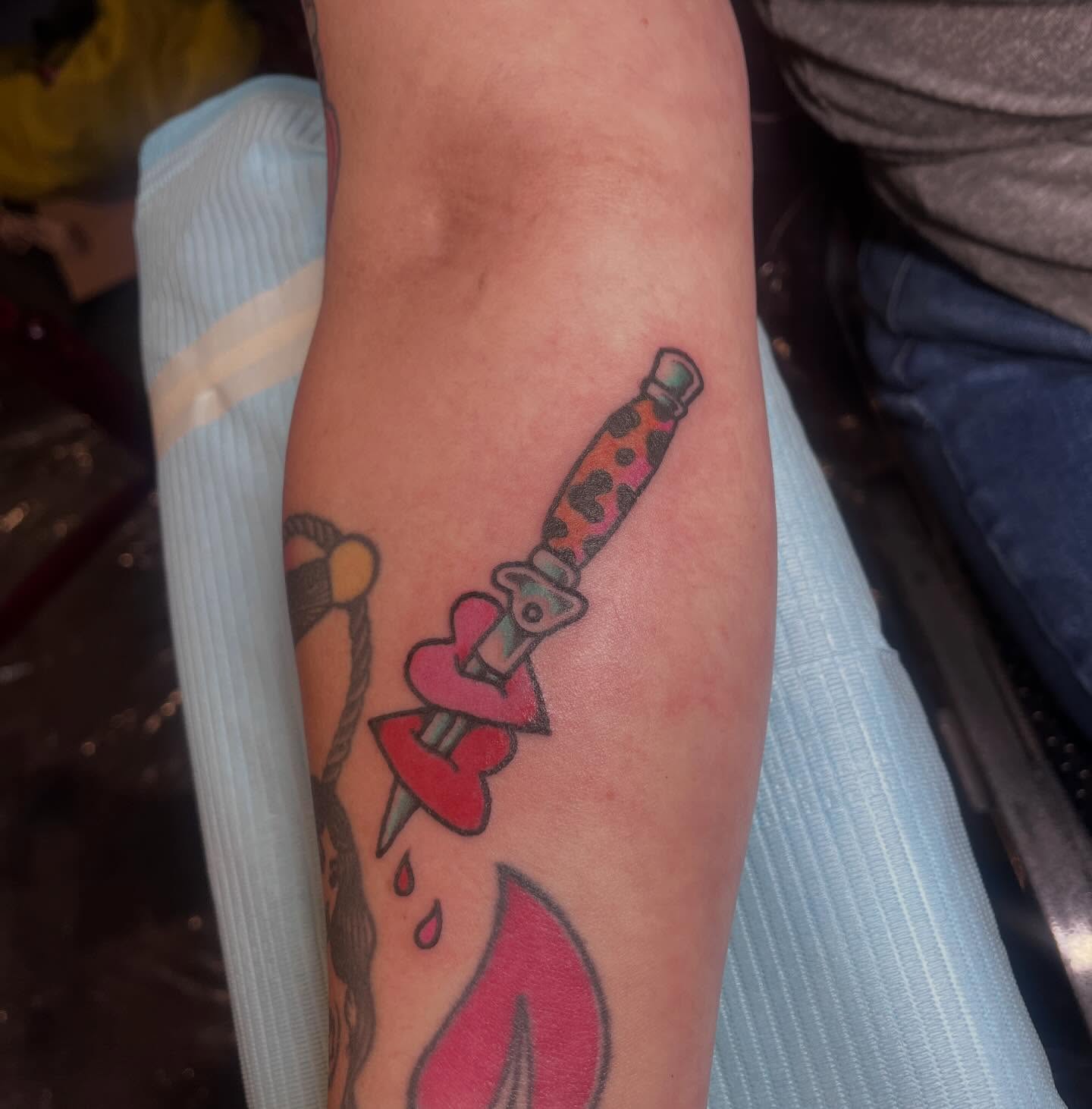Knife through heart American traditional tattoo on the forearm by madelynne (maddie) caldwell tattoos
