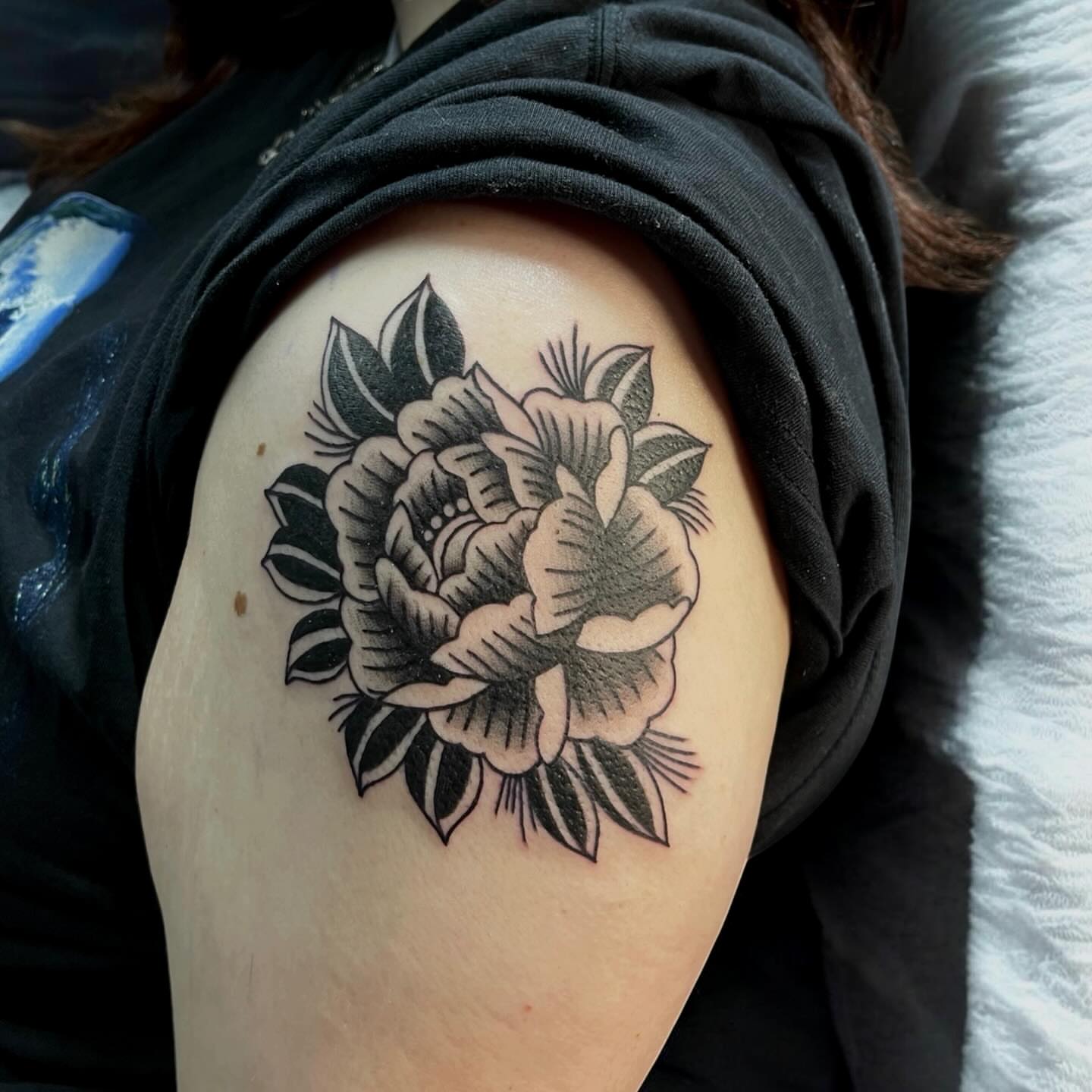 Flower American traditional tattoo on the shoulder by Brooke Kresco