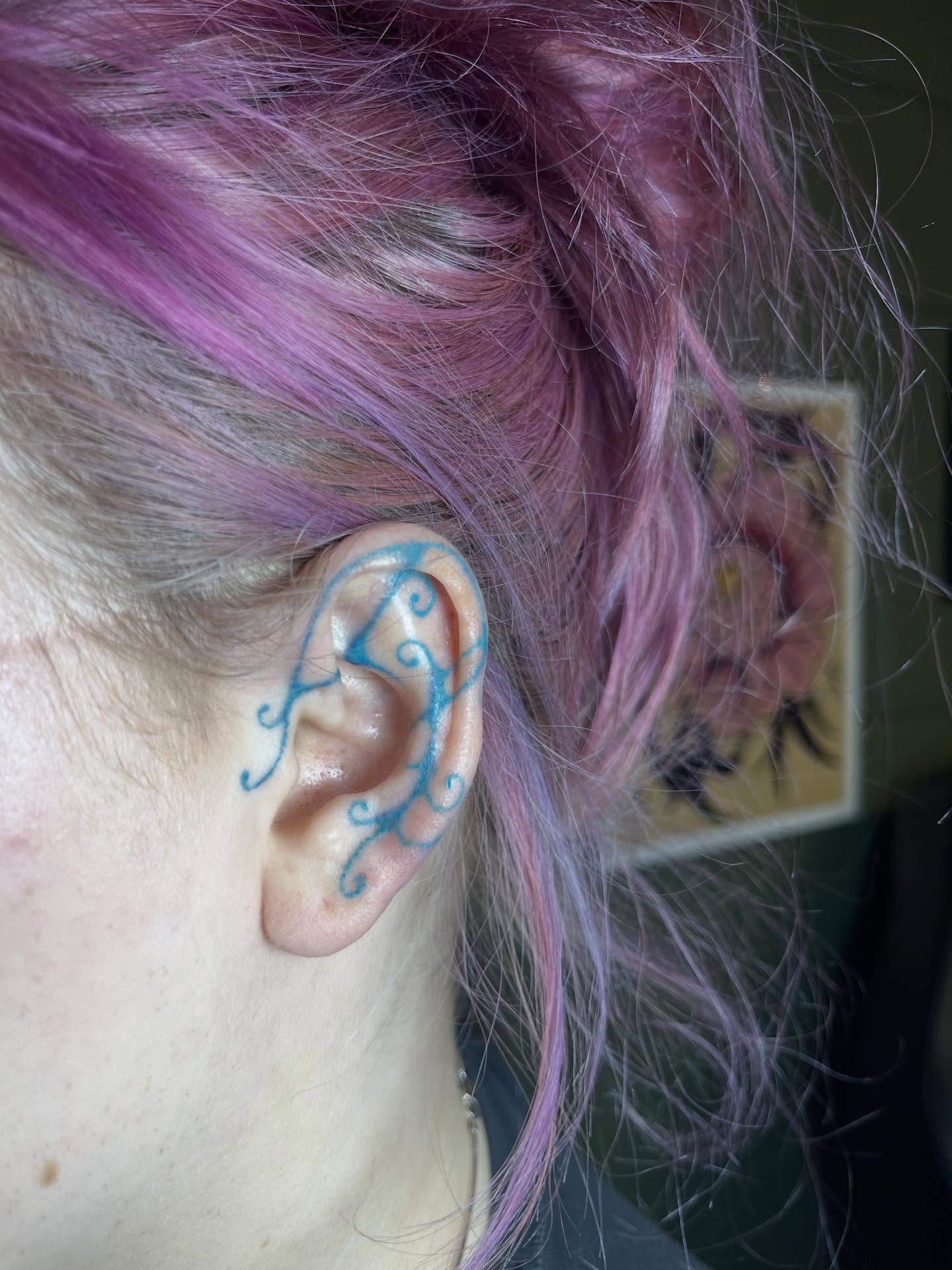 Ear fine line tattoo on the head by Permanent Pokes