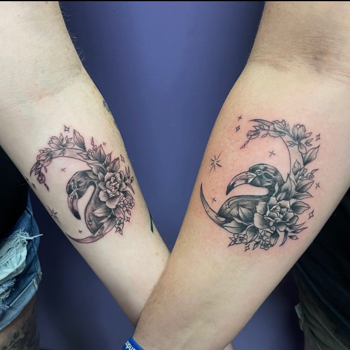 Raven and floral bouquet realism tattoo on the forearm by Mark Calloway