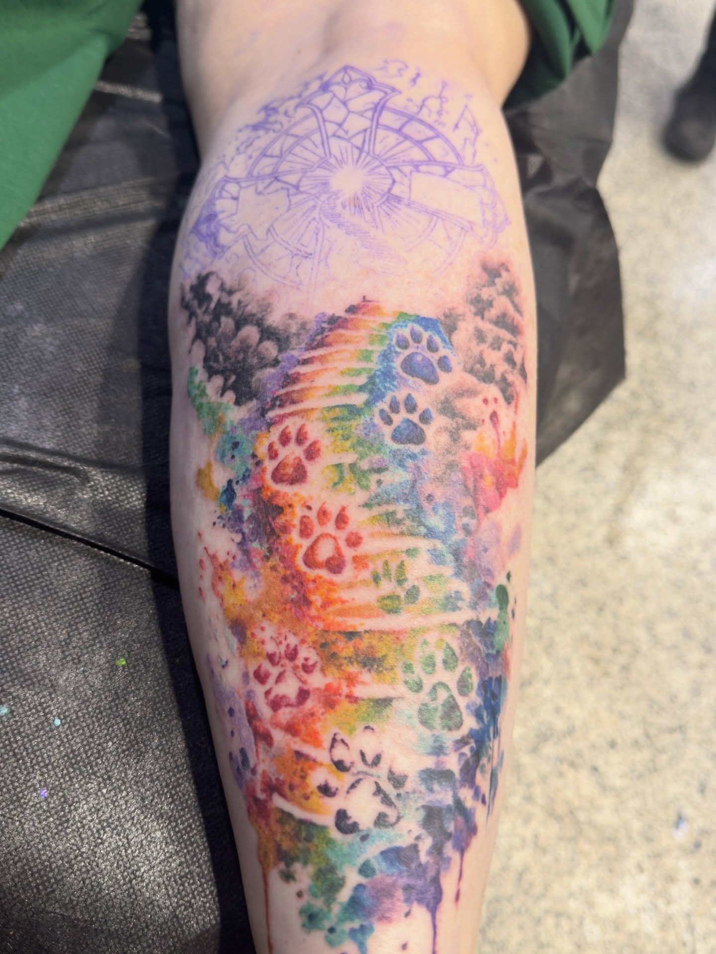 Watercolor splash watercolor tattoo on the forearm by Troy Butner