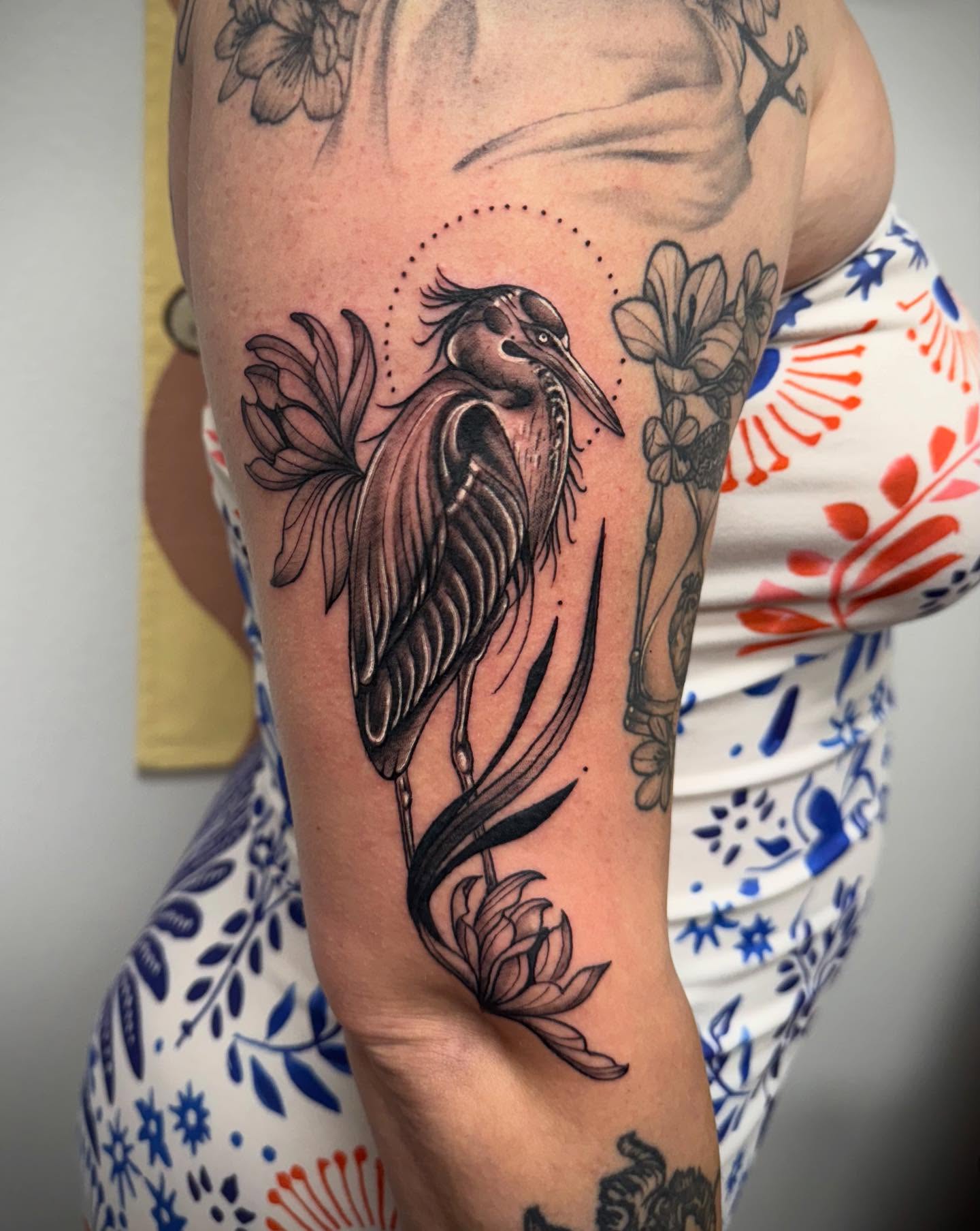 Heron and flowers black and grey tattoo on the forearm by KT