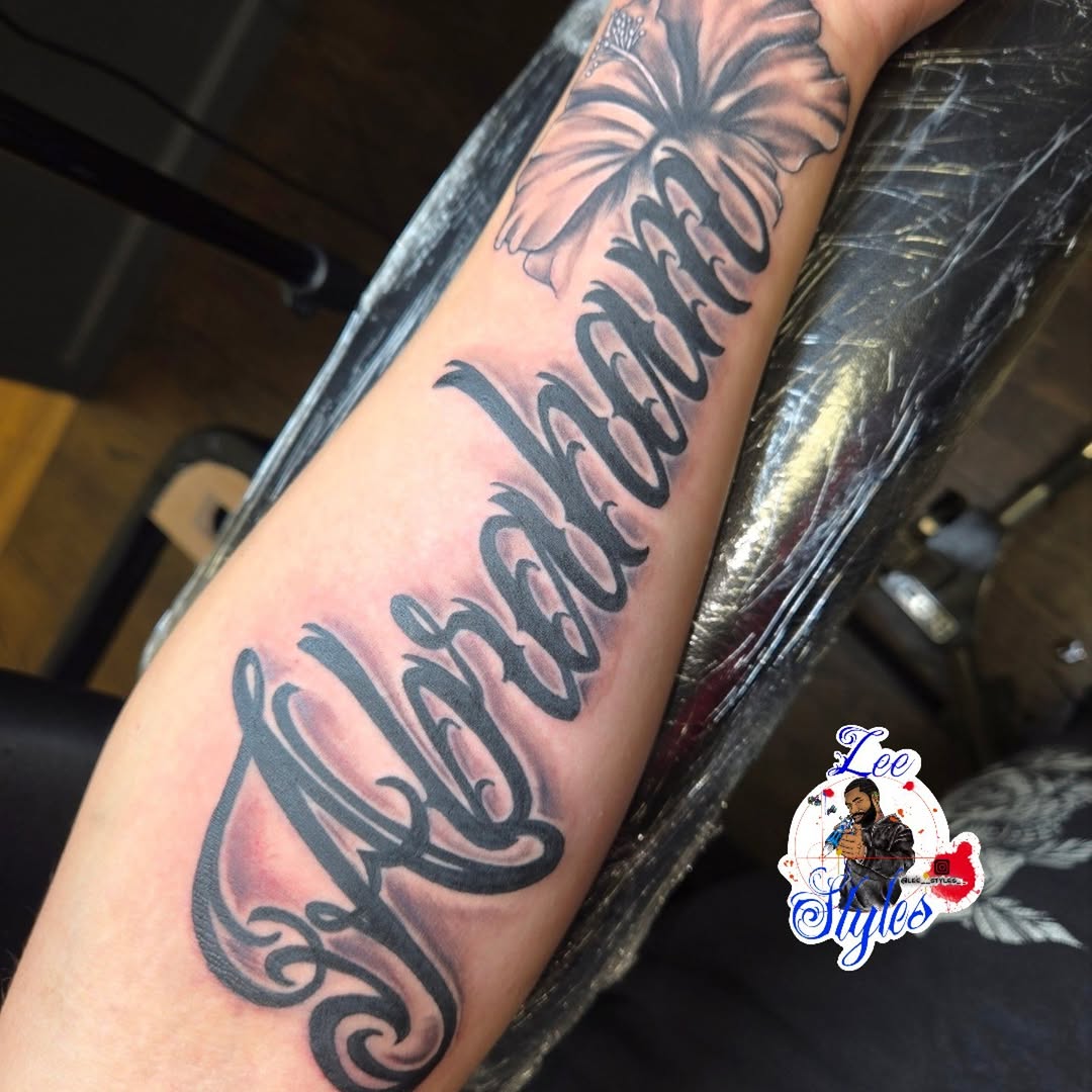 Abraham flower script lettering tattoo on the forearm by Lee Styles π¨