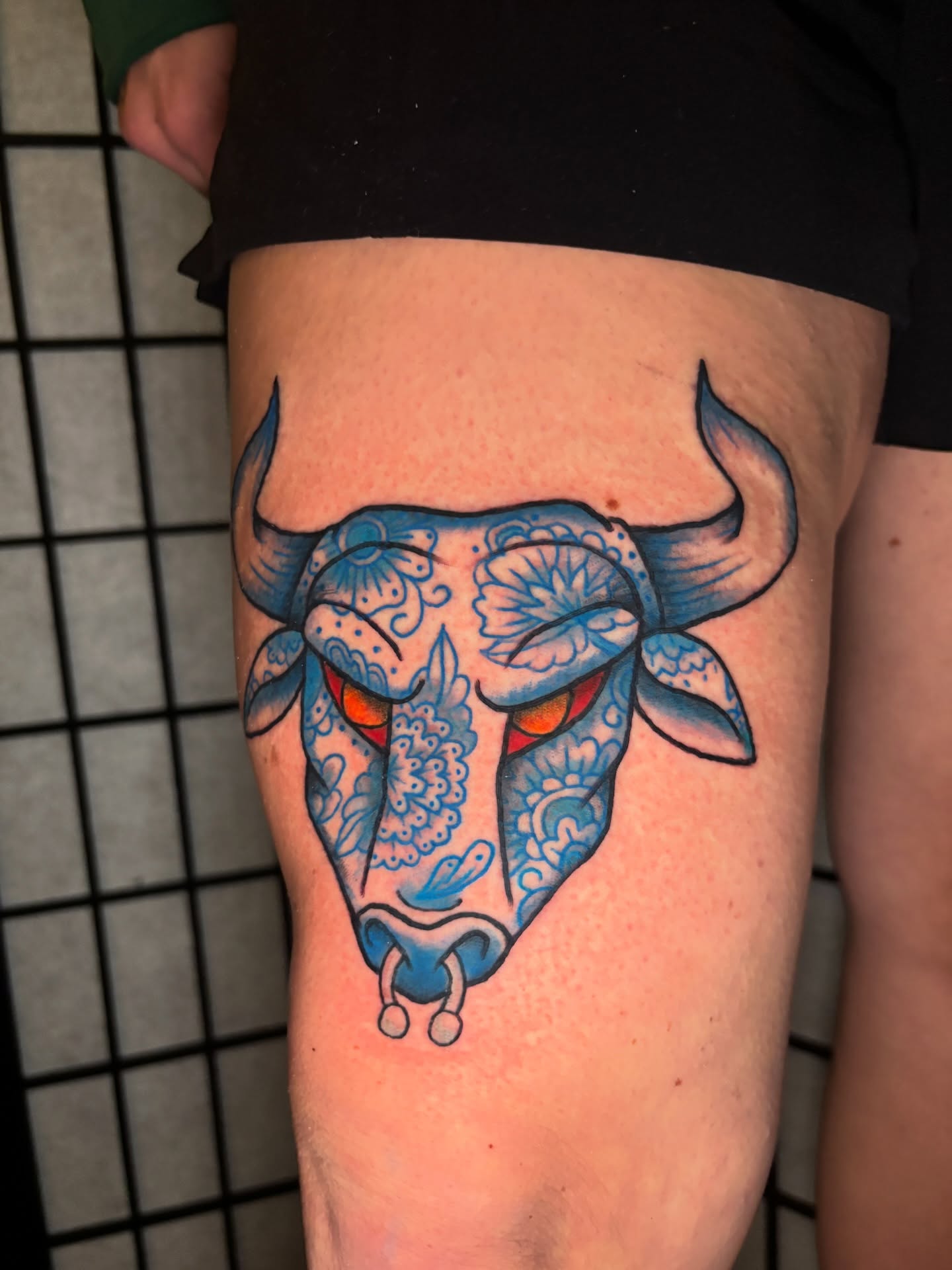 Bull skull American traditional tattoo on the thigh by Lilly Evans
