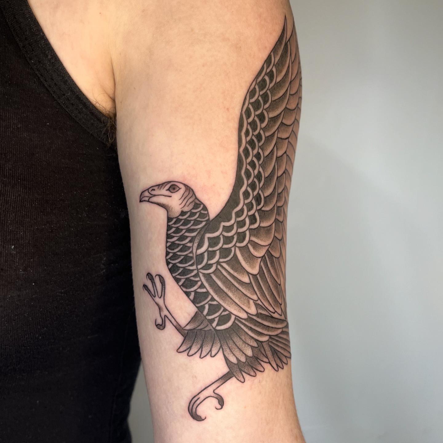 Eagle black and grey tattoo on the forearm by Iggy Montgomery (they