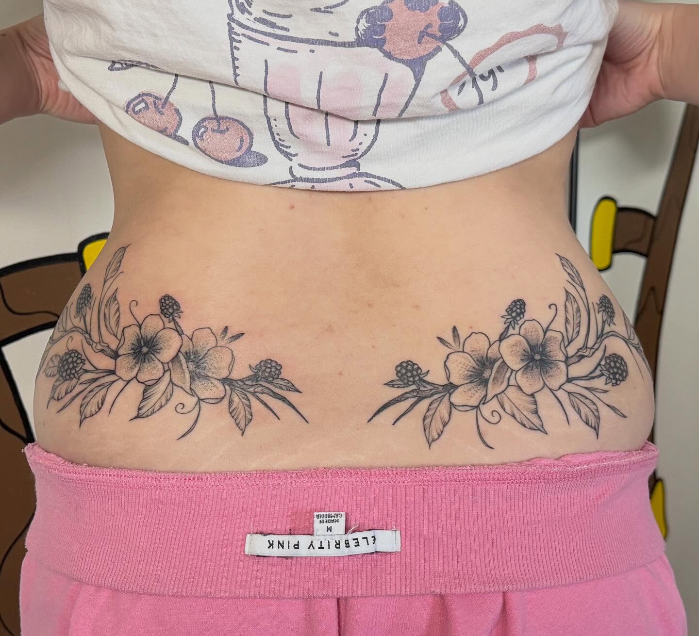 Floral arrangement black and grey tattoo on the torso by Sophia, New Carlisle, Ohio