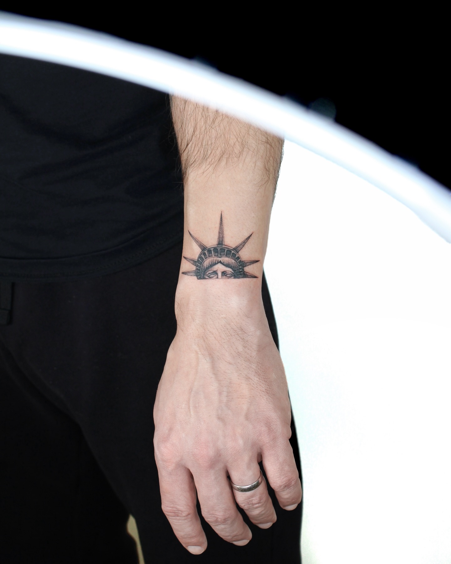 Statue of liberty black and grey tattoo on the forearm by Tatmostat