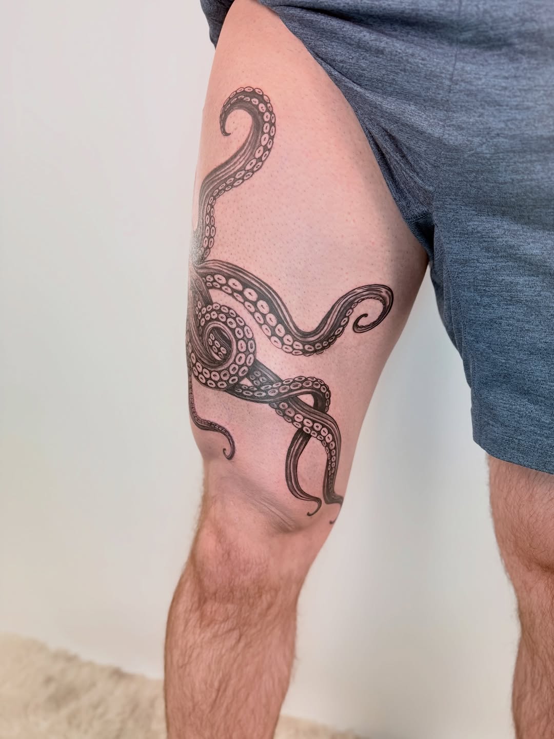 Octopus tentacles ornamental tattoo on the thigh by Yuri Chloe Ngo Tattoo Artist