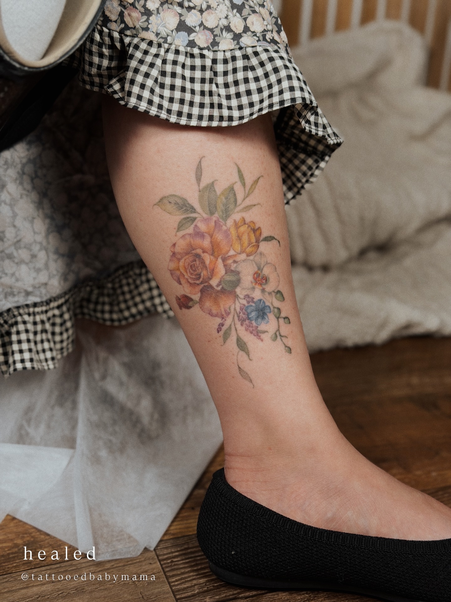 Floral bouquet watercolor tattoo on the calf by Andrea Evangelista