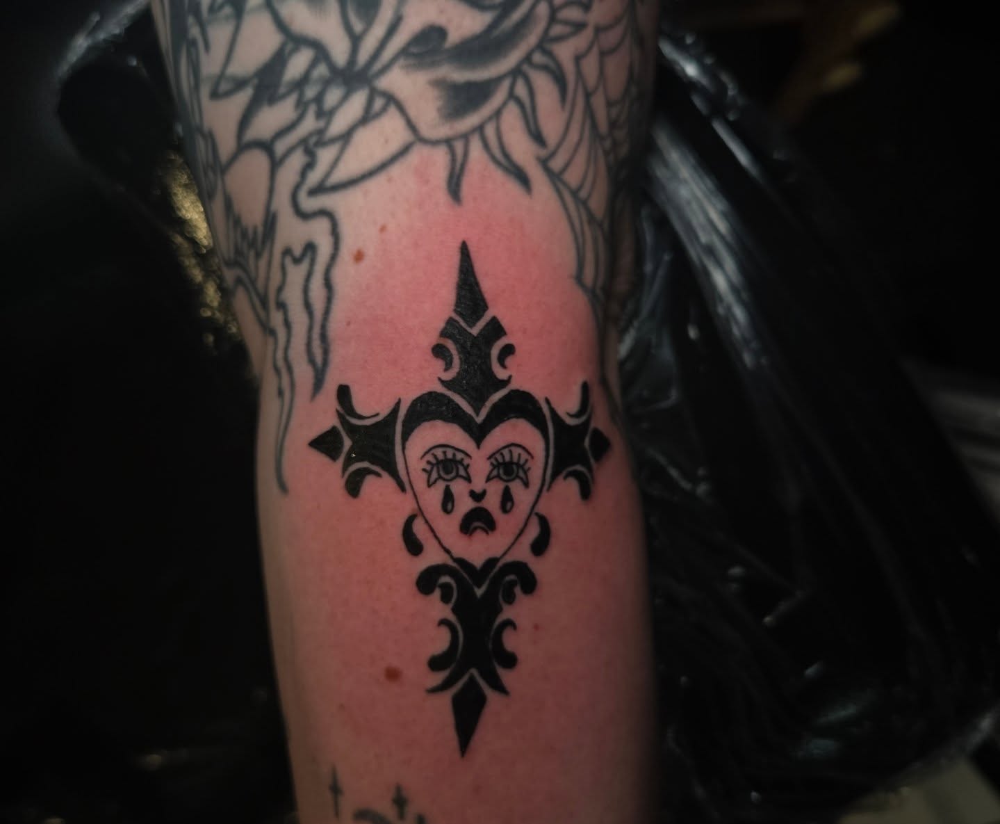 Fleur-de-lis with crying heart black and grey tattoo on the forearm by Lane