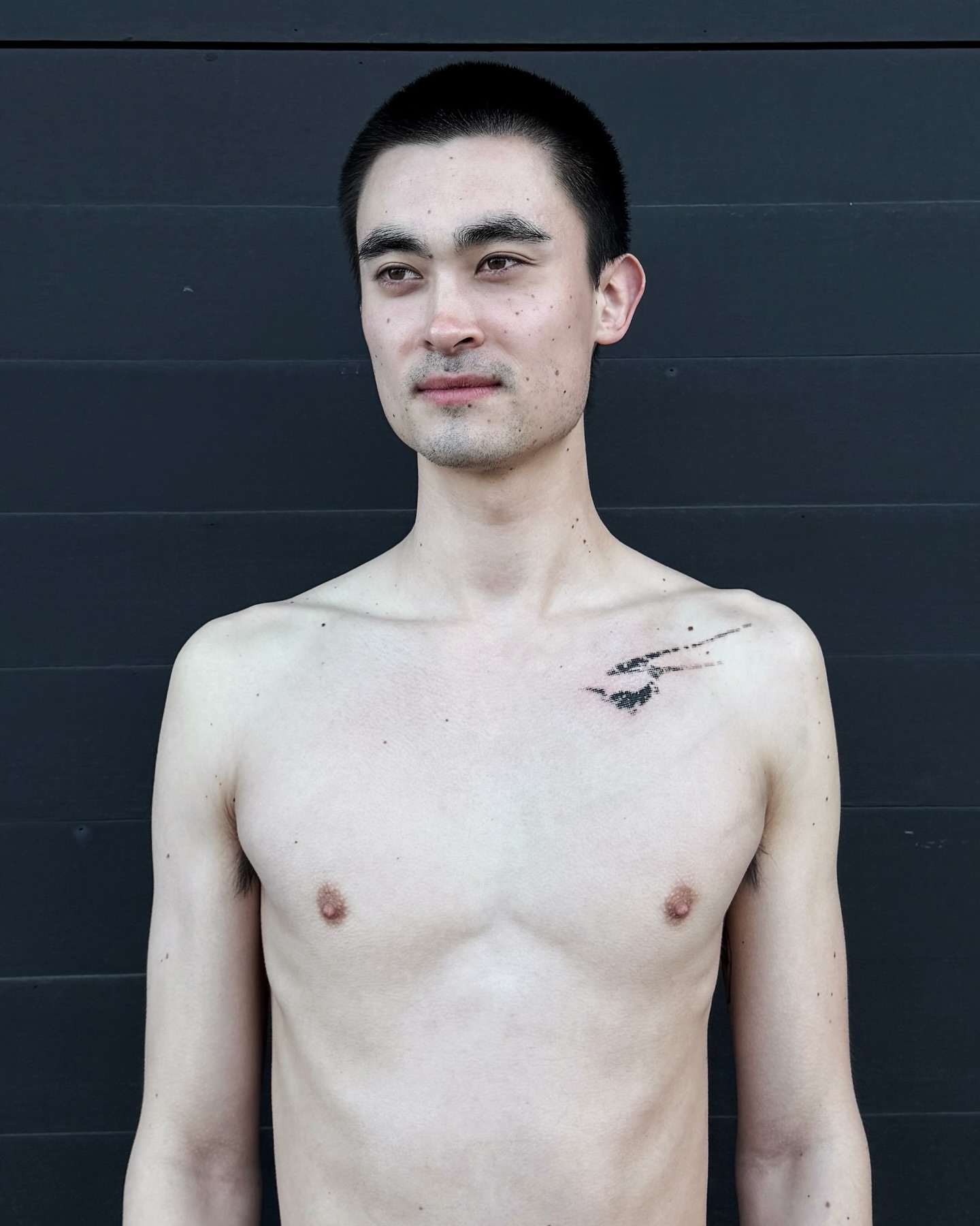 Arrow black and grey tattoo on the chest by Haza