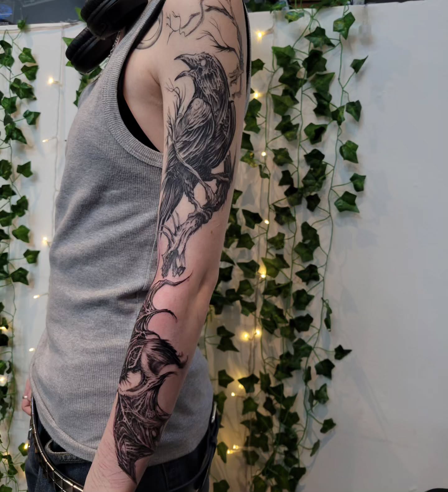 Crow black and grey tattoo on the forearm by Uku Tattoos, Cambridge, England