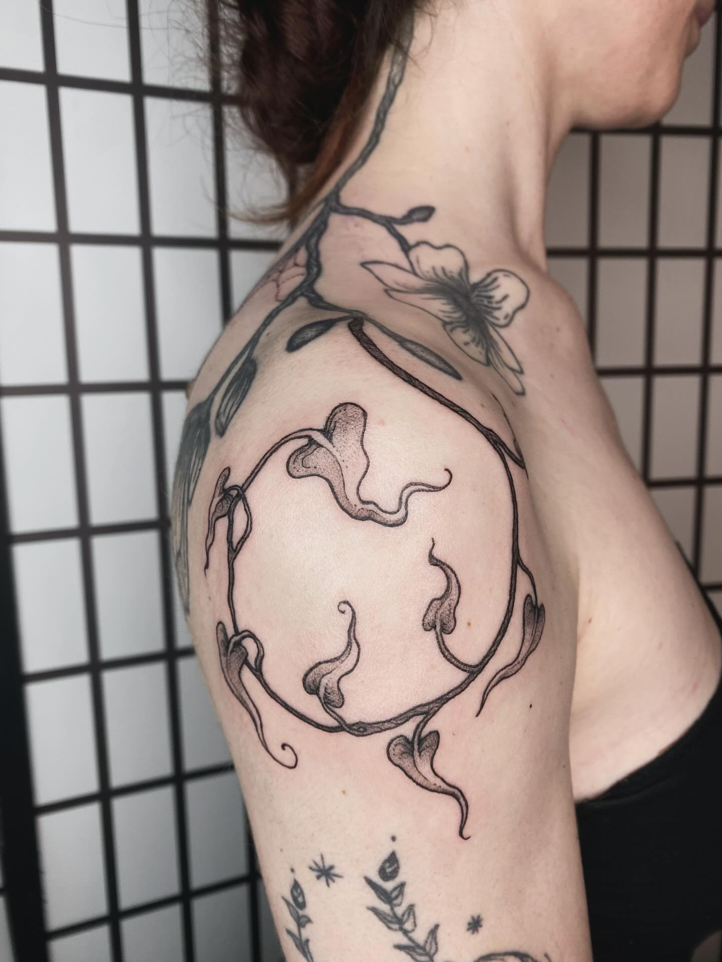 Floral vine black and grey tattoo on the shoulder by sarah 🗝️