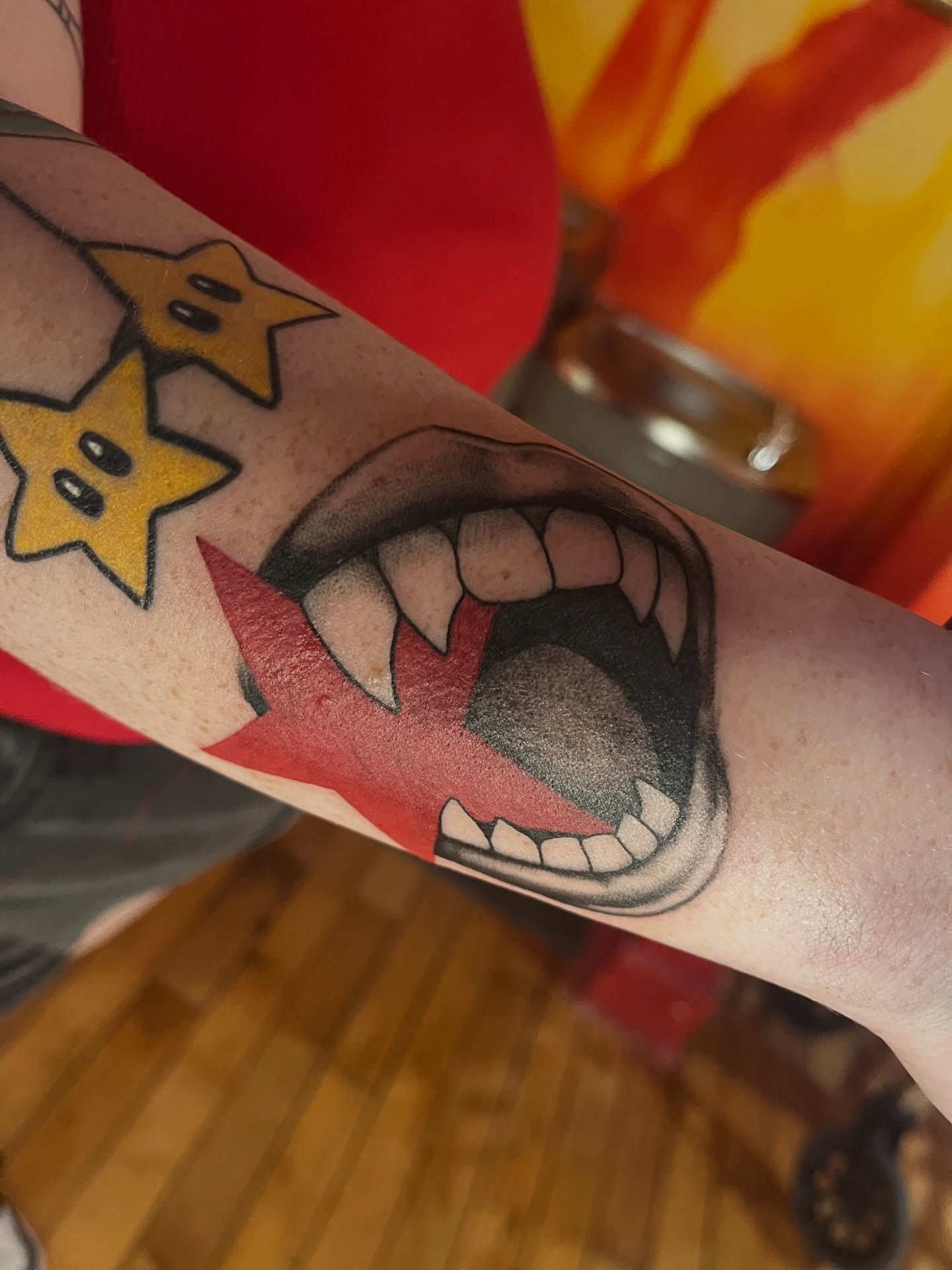 Fangs and stars American traditional tattoo on the forearm by Zoe Phan, Richmond, Virginia