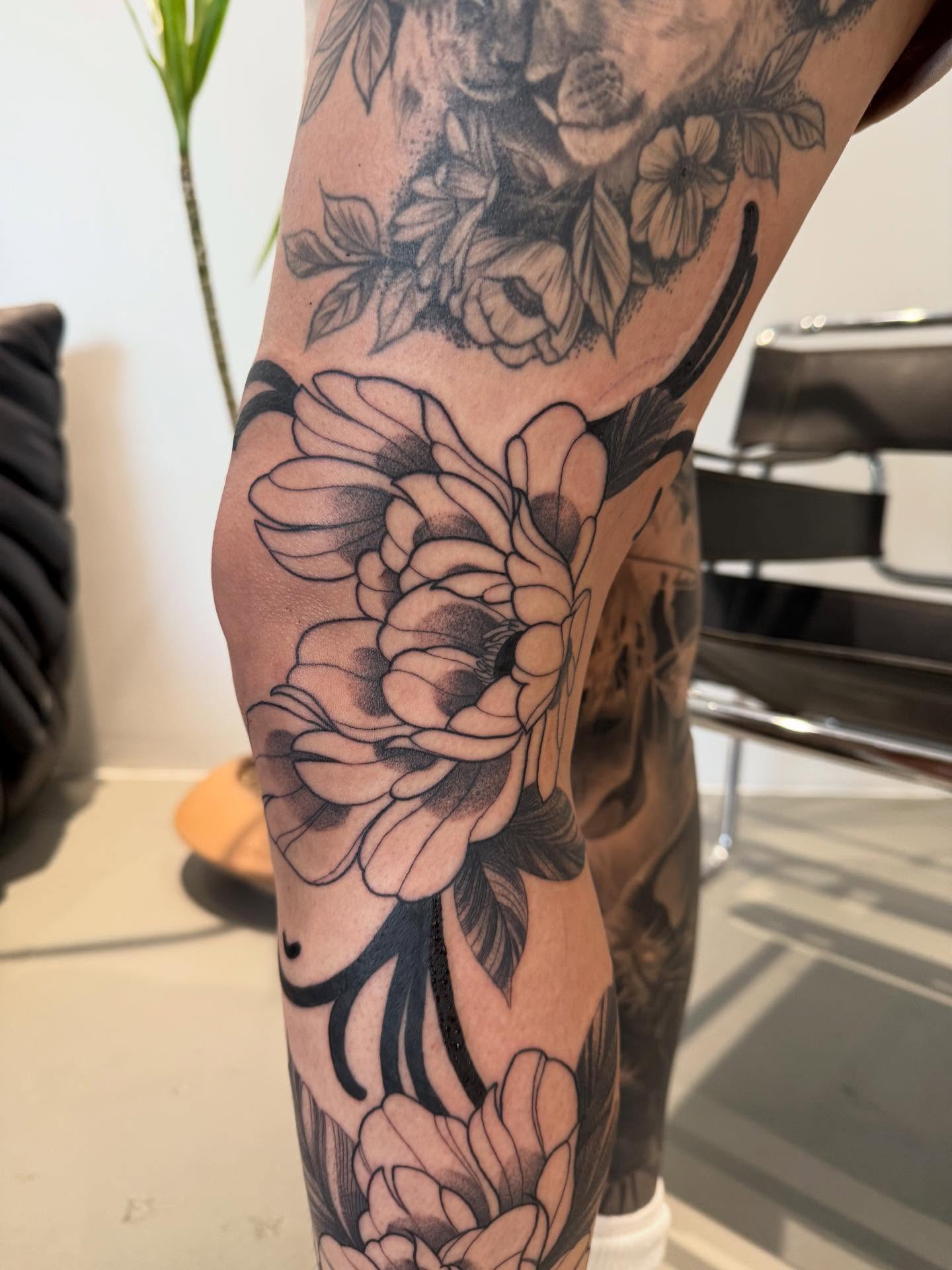Floral bouquet black and grey tattoo on the forearm by Julianna