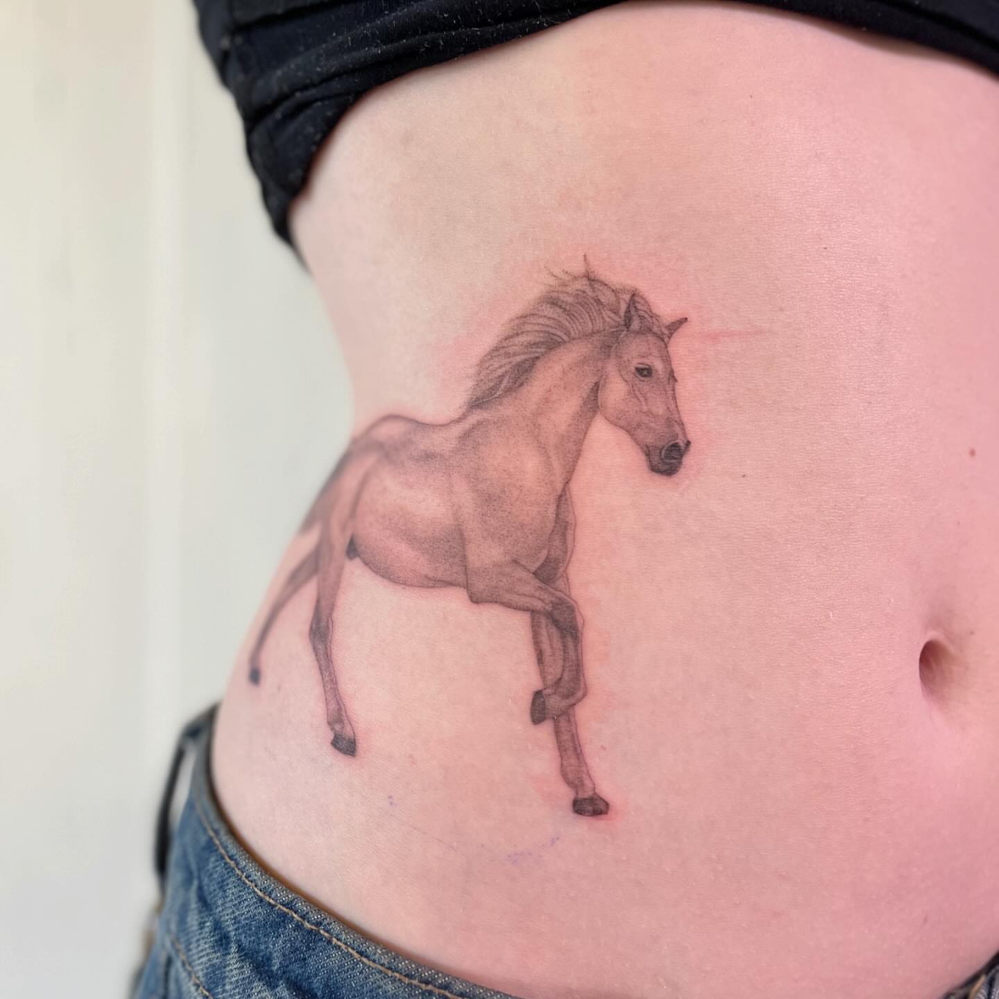 Horse realism tattoo on the ribs by 🌼DaisyDaiz🕸️