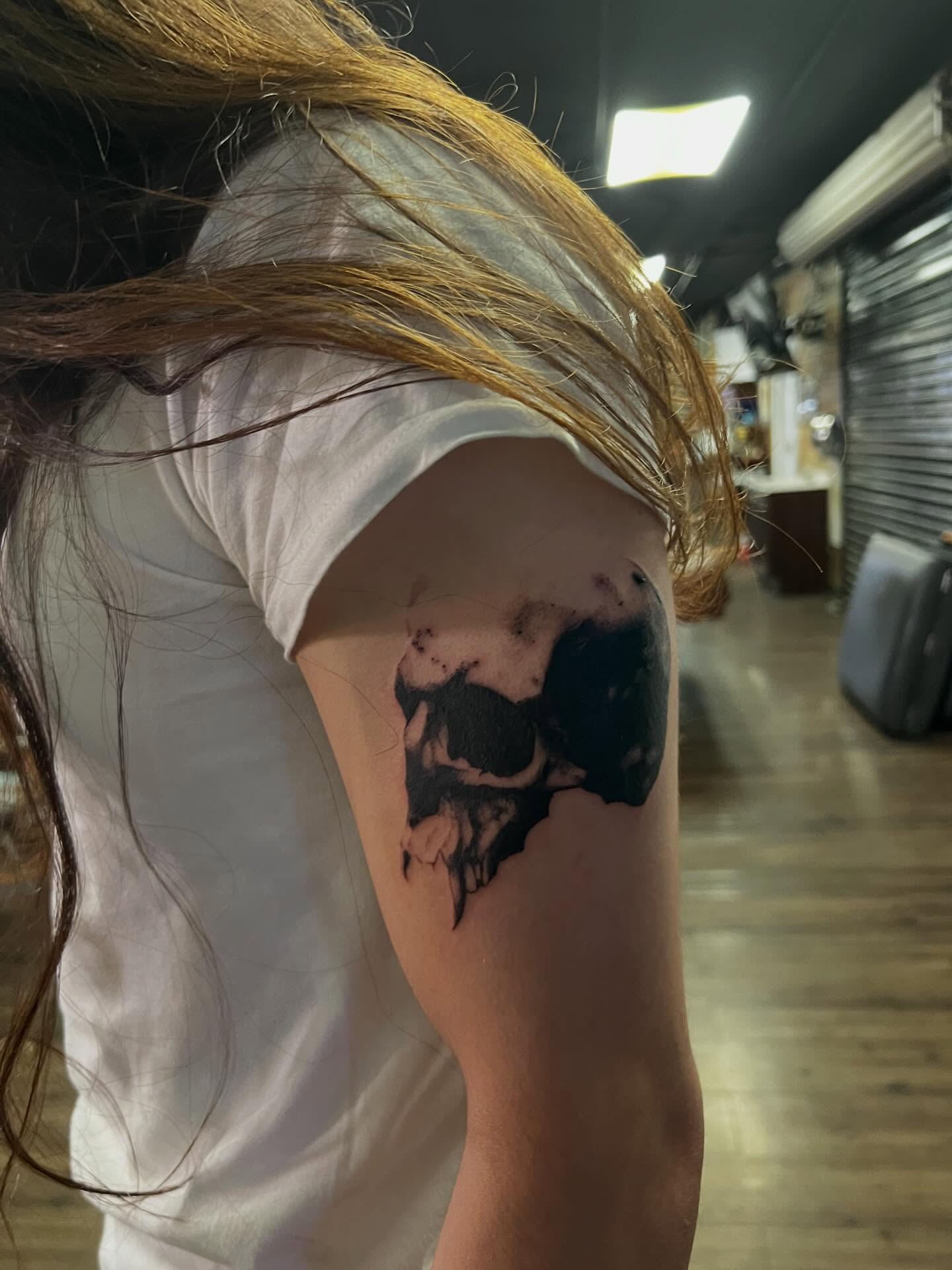 Skull black and grey tattoo on the shoulder by @halfwit__