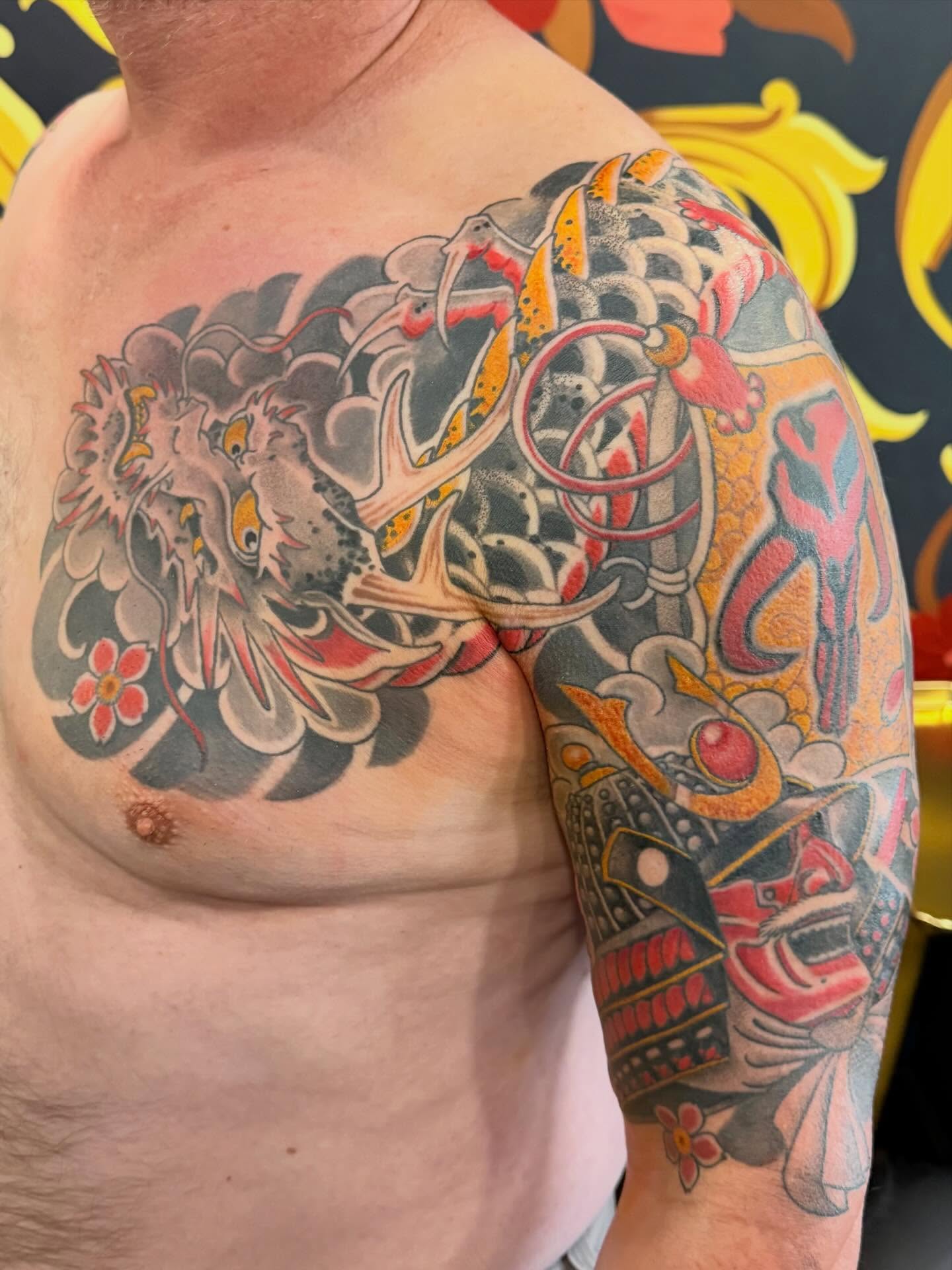 Koi fish and dragon japanese irezumi tattoo on the shoulder by English Cousins, Nashville, Tennessee