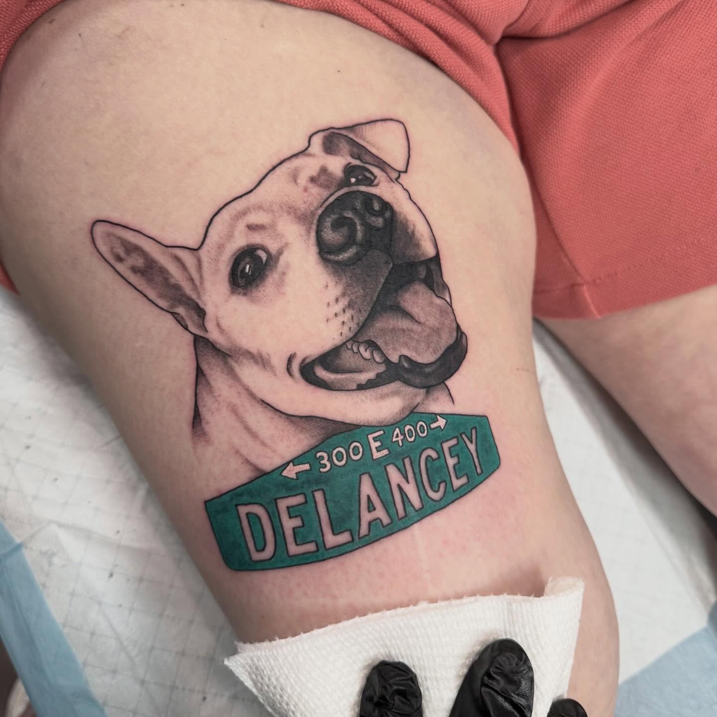 Dog with street sign realism tattoo on the thigh by Liz Glitz - Philadelphia Tattoo Artist