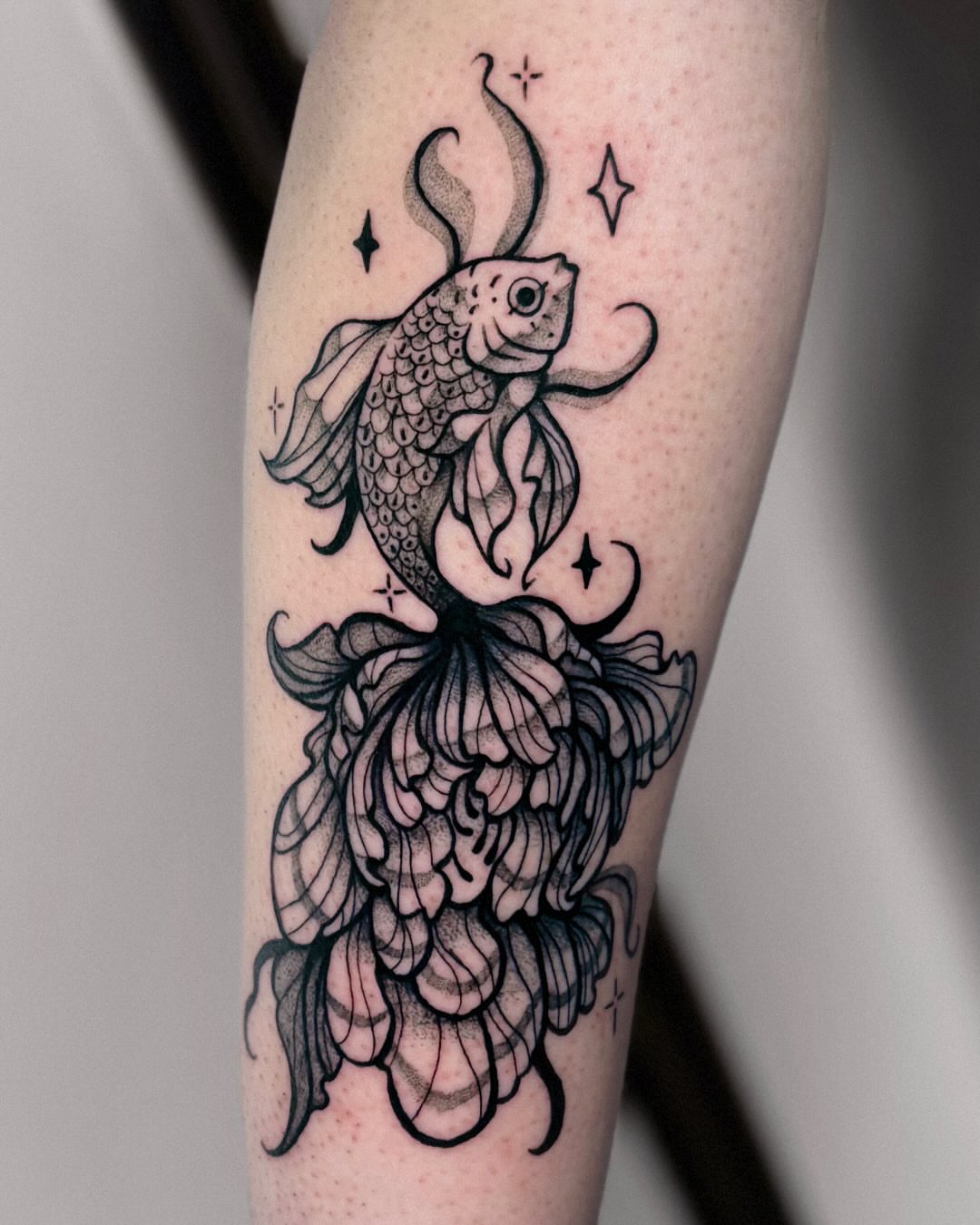 Koi fish black and grey tattoo on the forearm by Kal