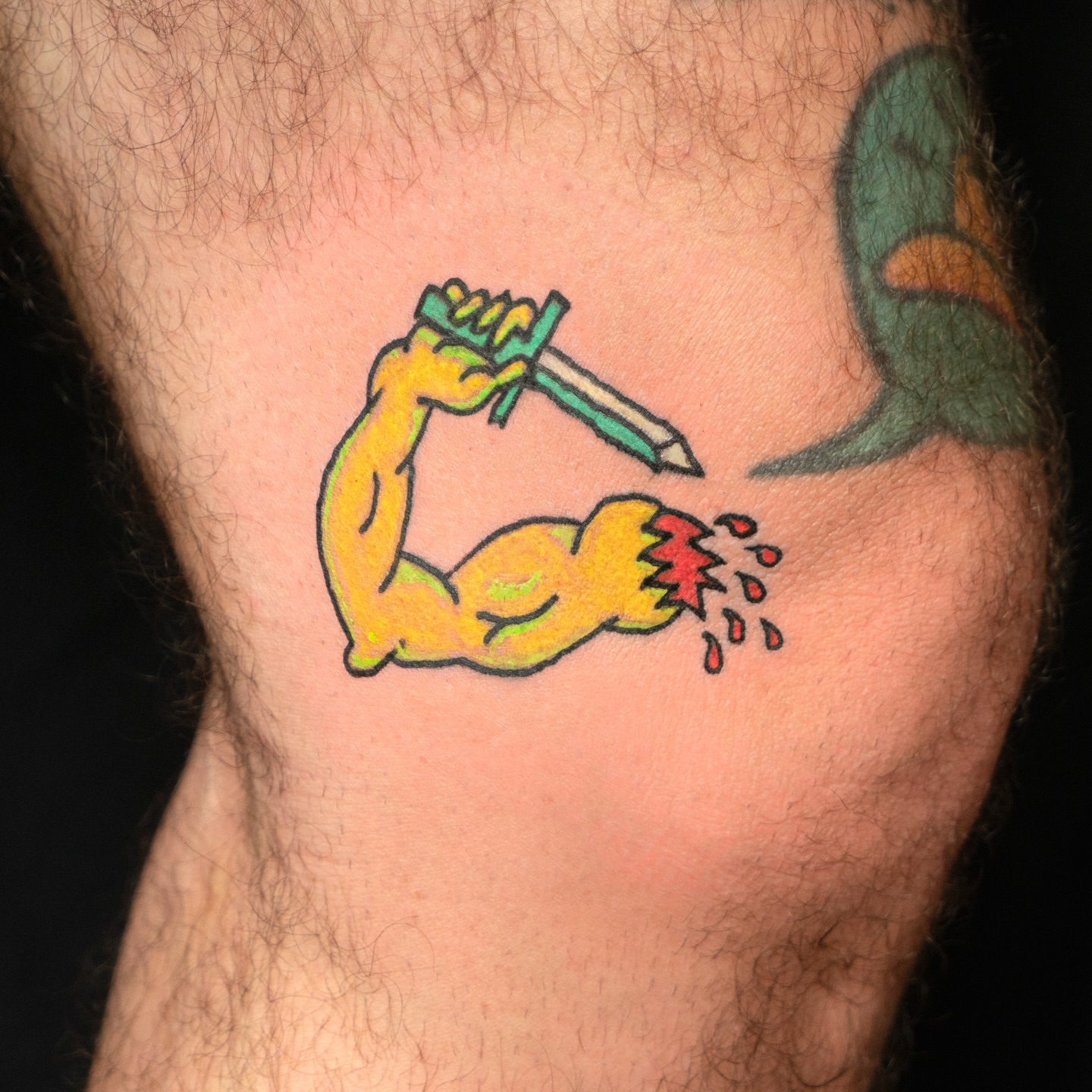 Muscle breaking pencil new school tattoo on the forearm by Flash Boom Bang Tattoo
