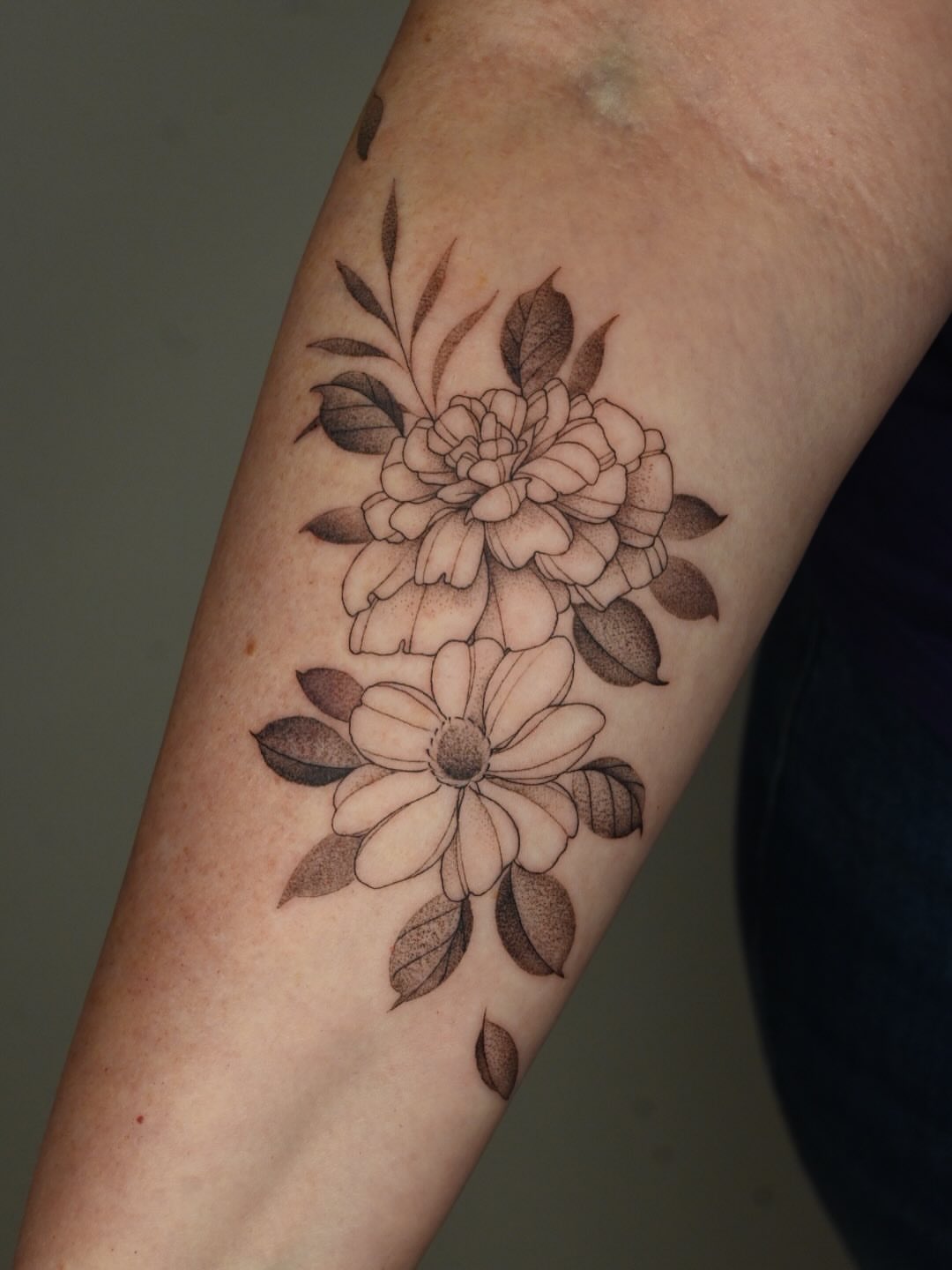 Flowers black and grey tattoo on the forearm by Simba Nguyen