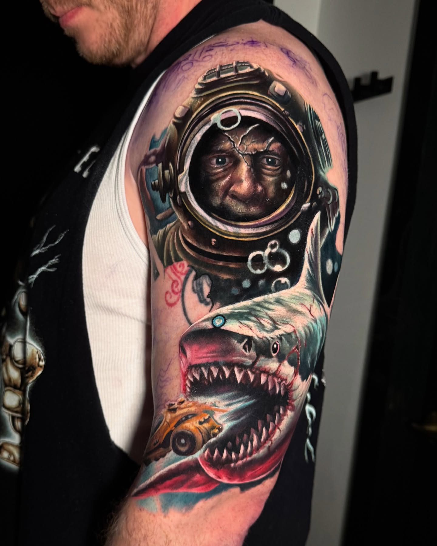 Diver and shark realism tattoo on the upper arm by Inexor tattoos
