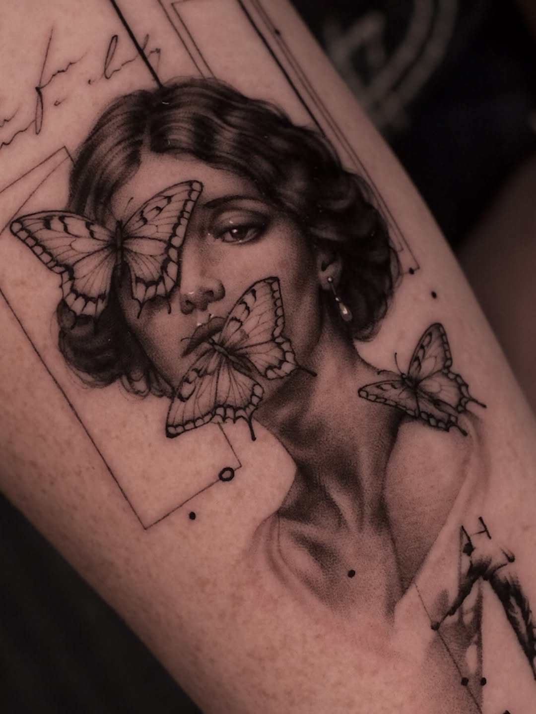 Woman with butterflies surrealism tattoo on the forearm by Oleksandr Moroz