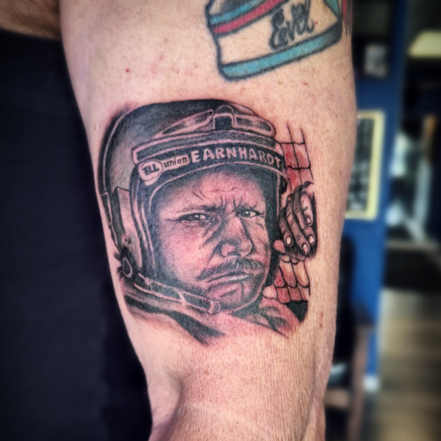 Nascar driver realism tattoo on the forearm by Kate