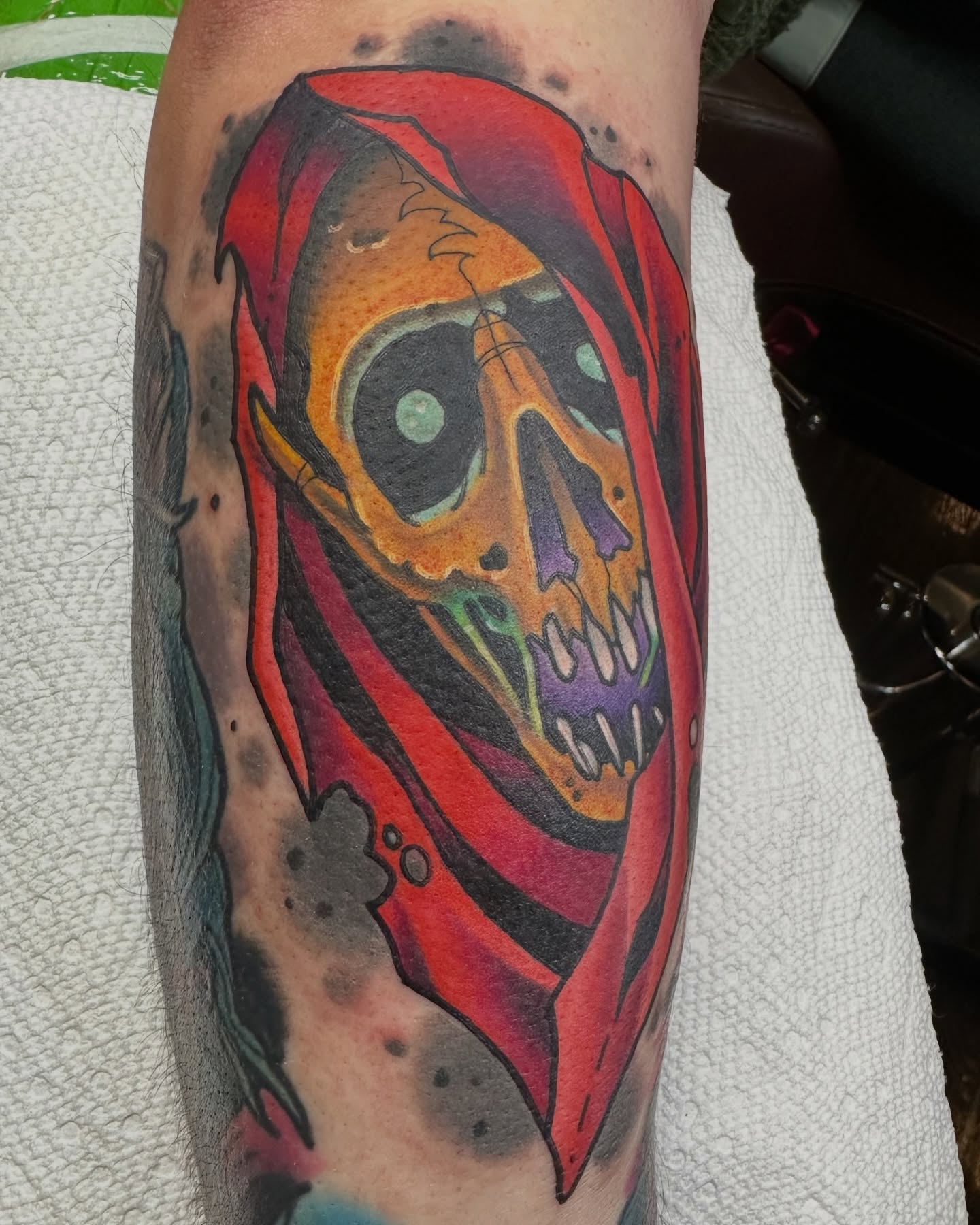 Skull with hood American traditional tattoo on the forearm by Edward Knowles