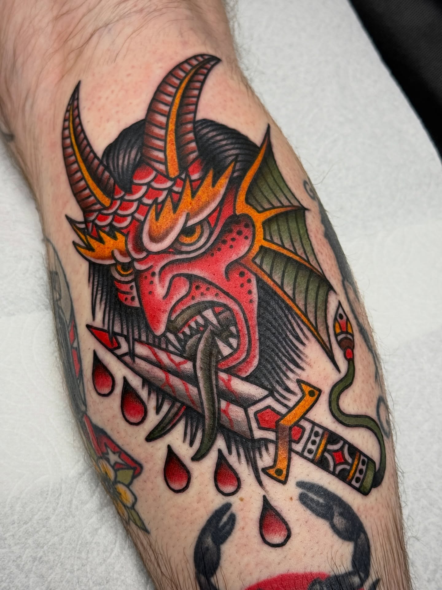 Demon head American traditional tattoo on the forearm by Jordan Allen