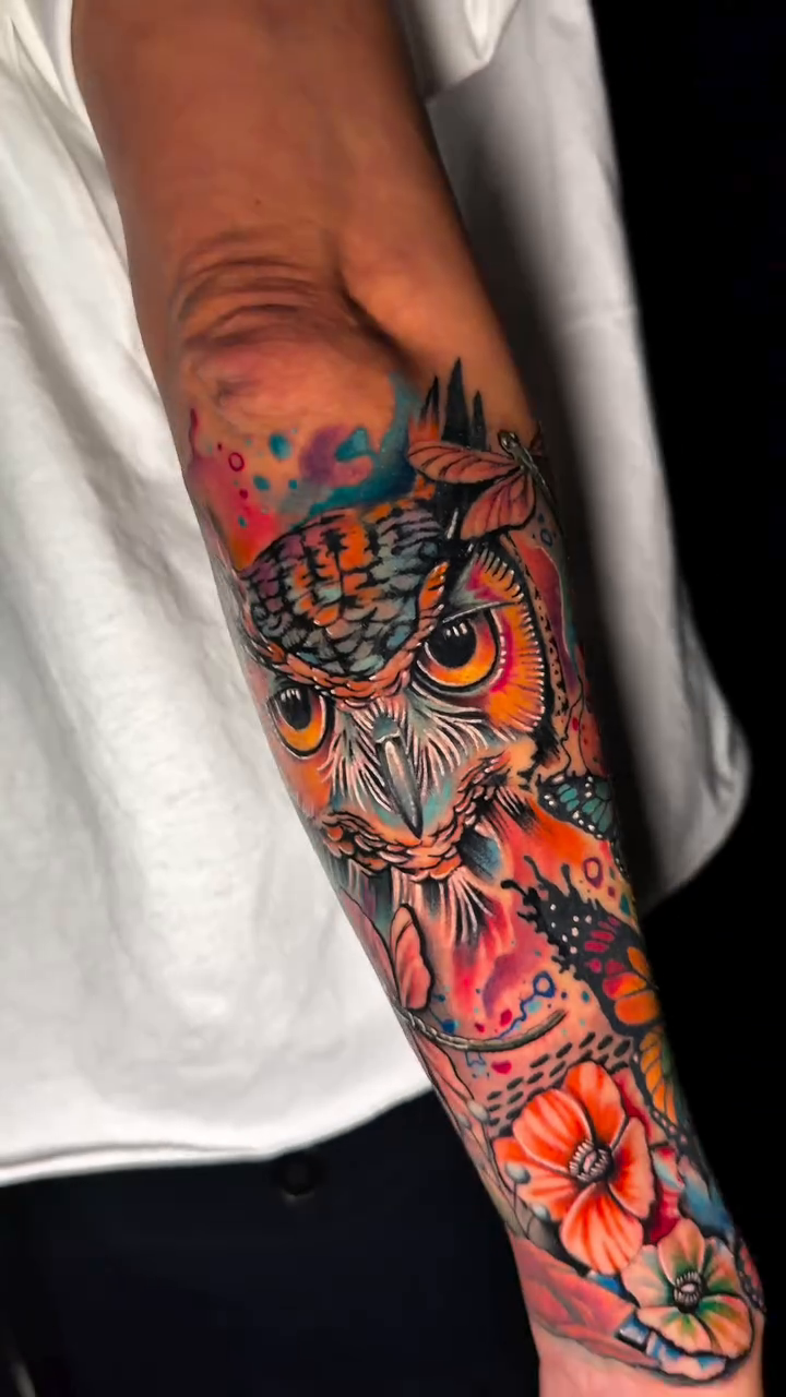 Owl with flowers neo-traditional tattoo by Travis Sleeper