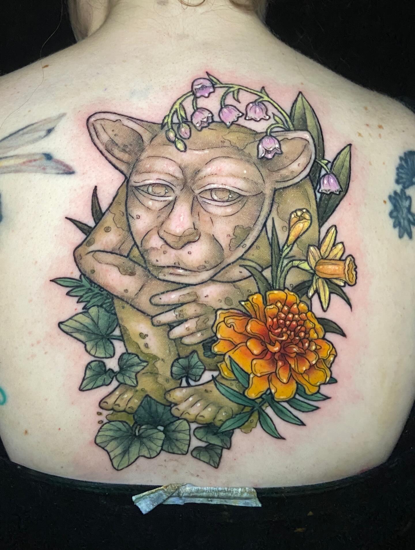 Gnome with flowers realism tattoo on the back by Dawn Carr, Richmond, Virginia