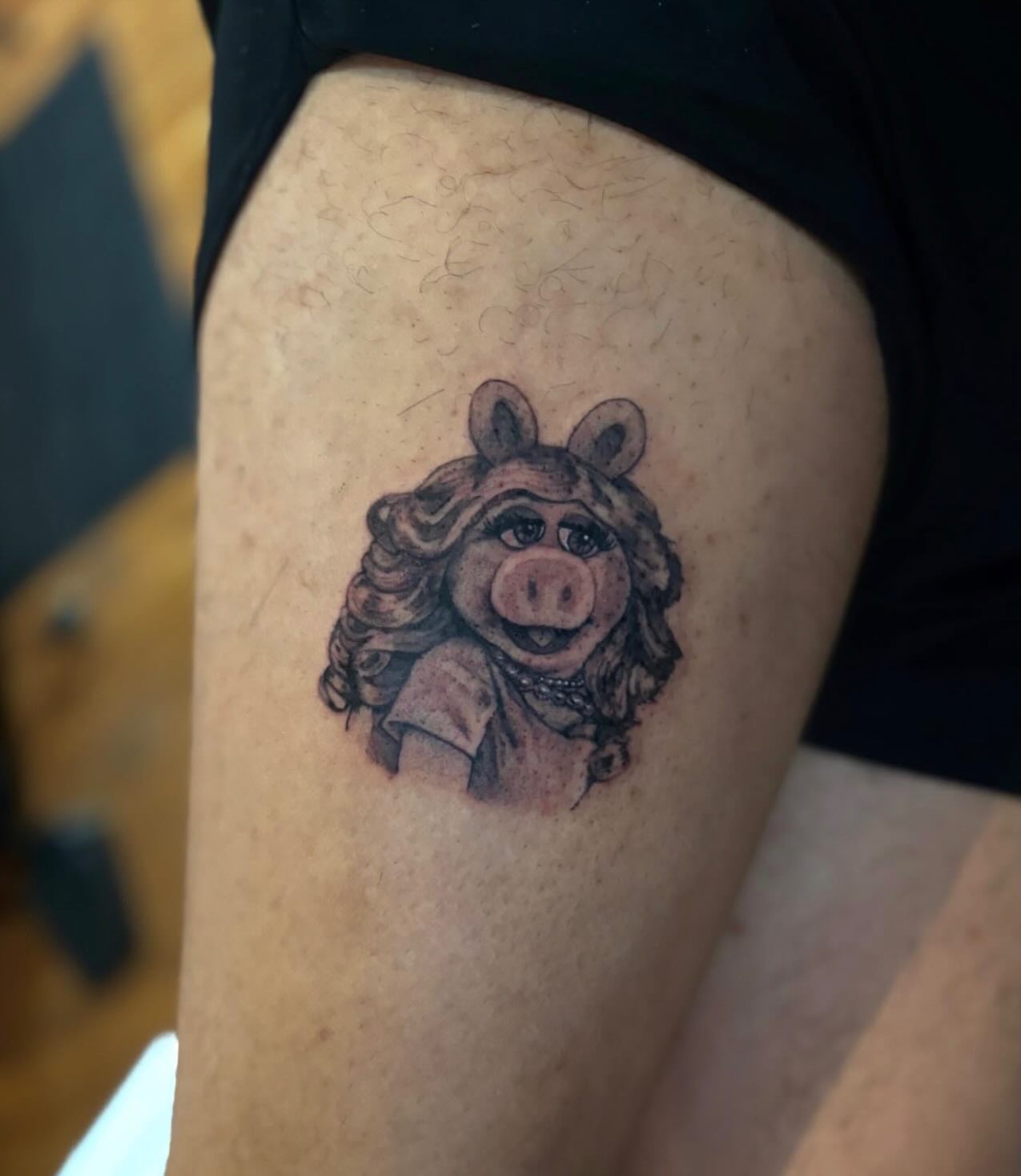 Miss piggy realism tattoo on the thigh by Dylan Coverdale
