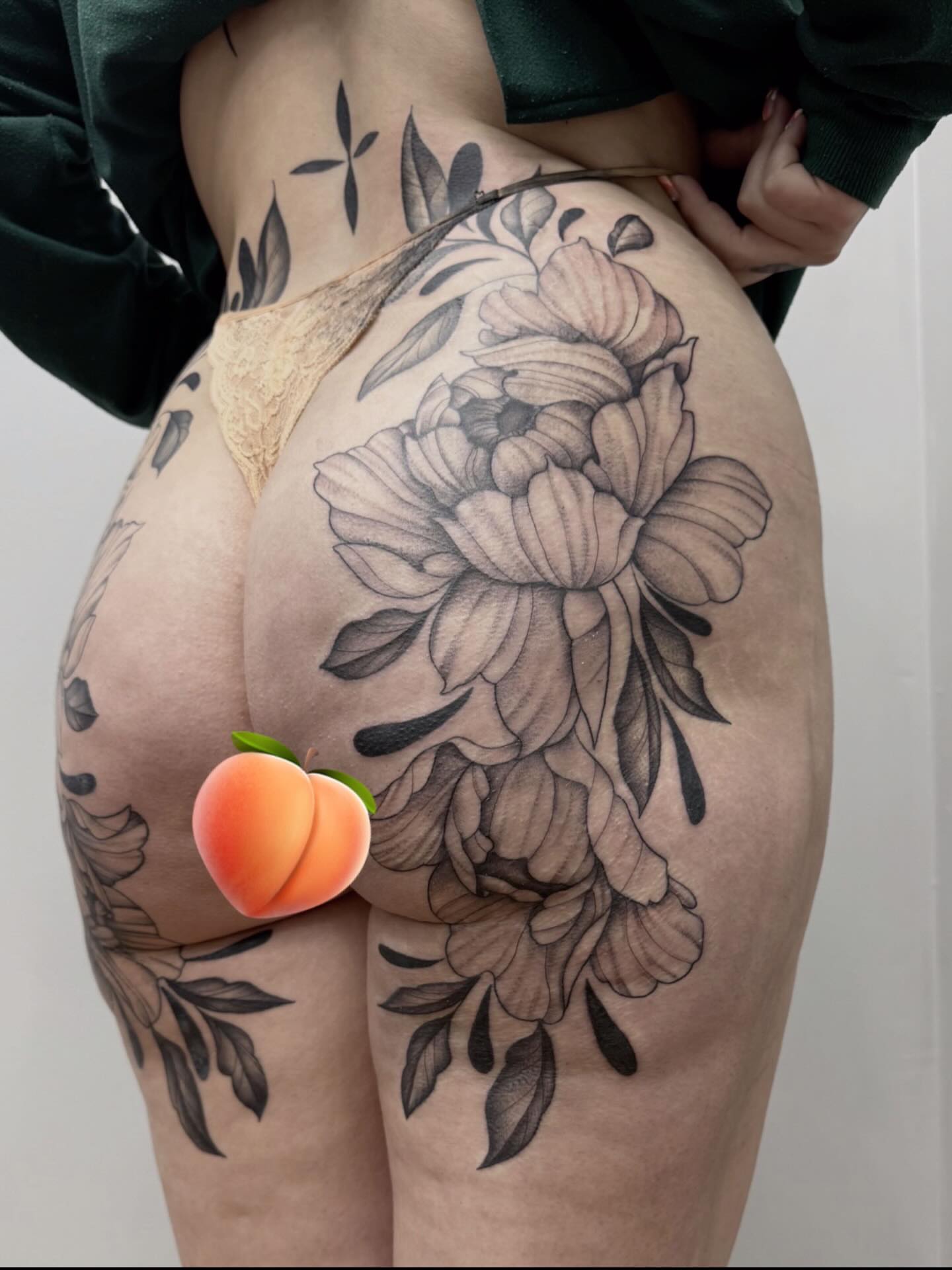 Peony black and grey tattoo on the thigh by Emmy