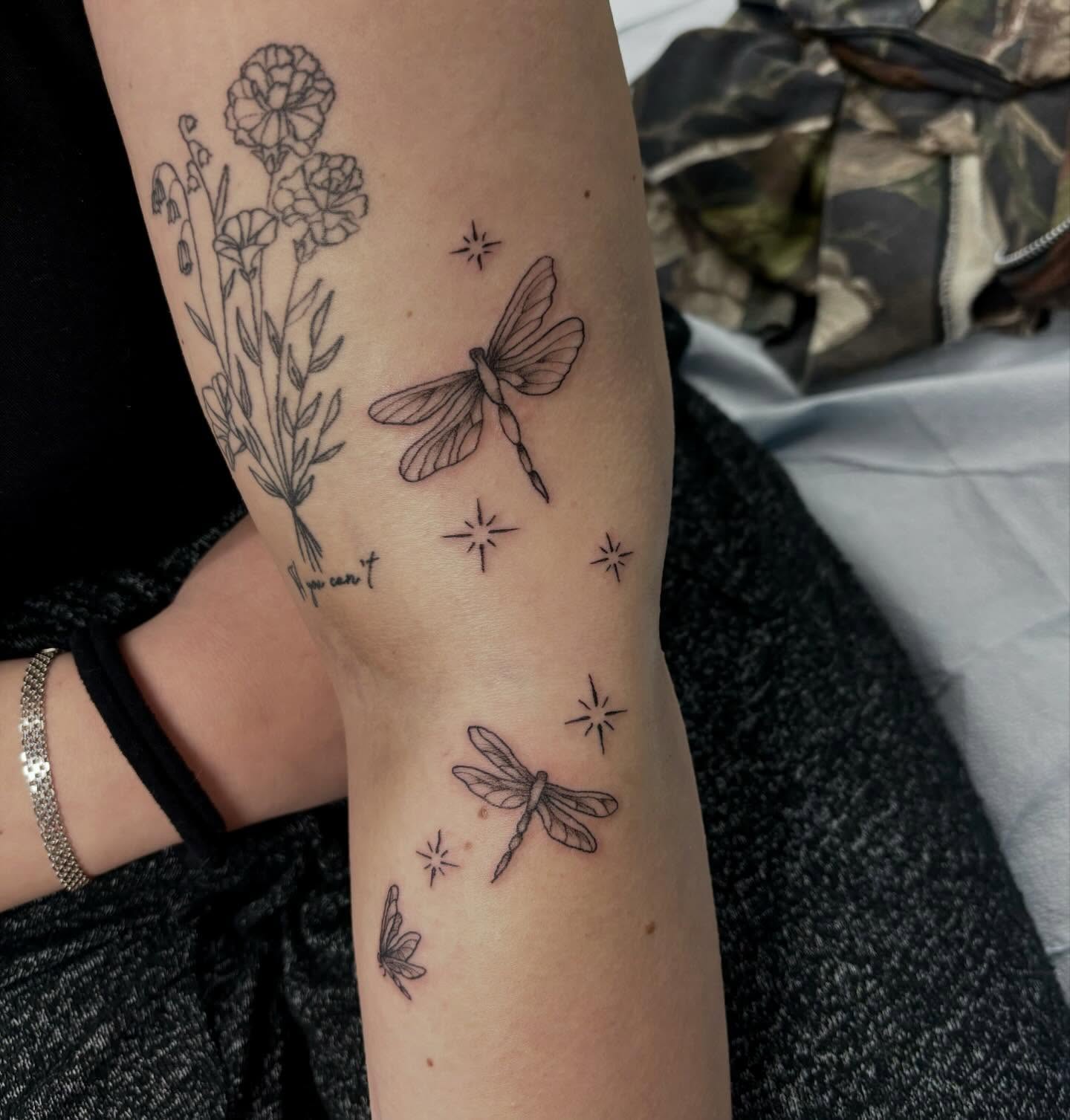 Dragonflies and flowers minimalist tattoo on the forearm by ✮ ✄ star ✮ ✄
