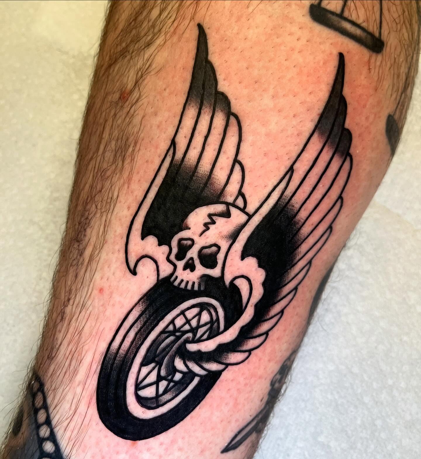 Winged skull black and grey tattoo on the forearm by CJ Ligocki - Ferndale Detroit Michigan Tattoo, Ferndale, Michigan