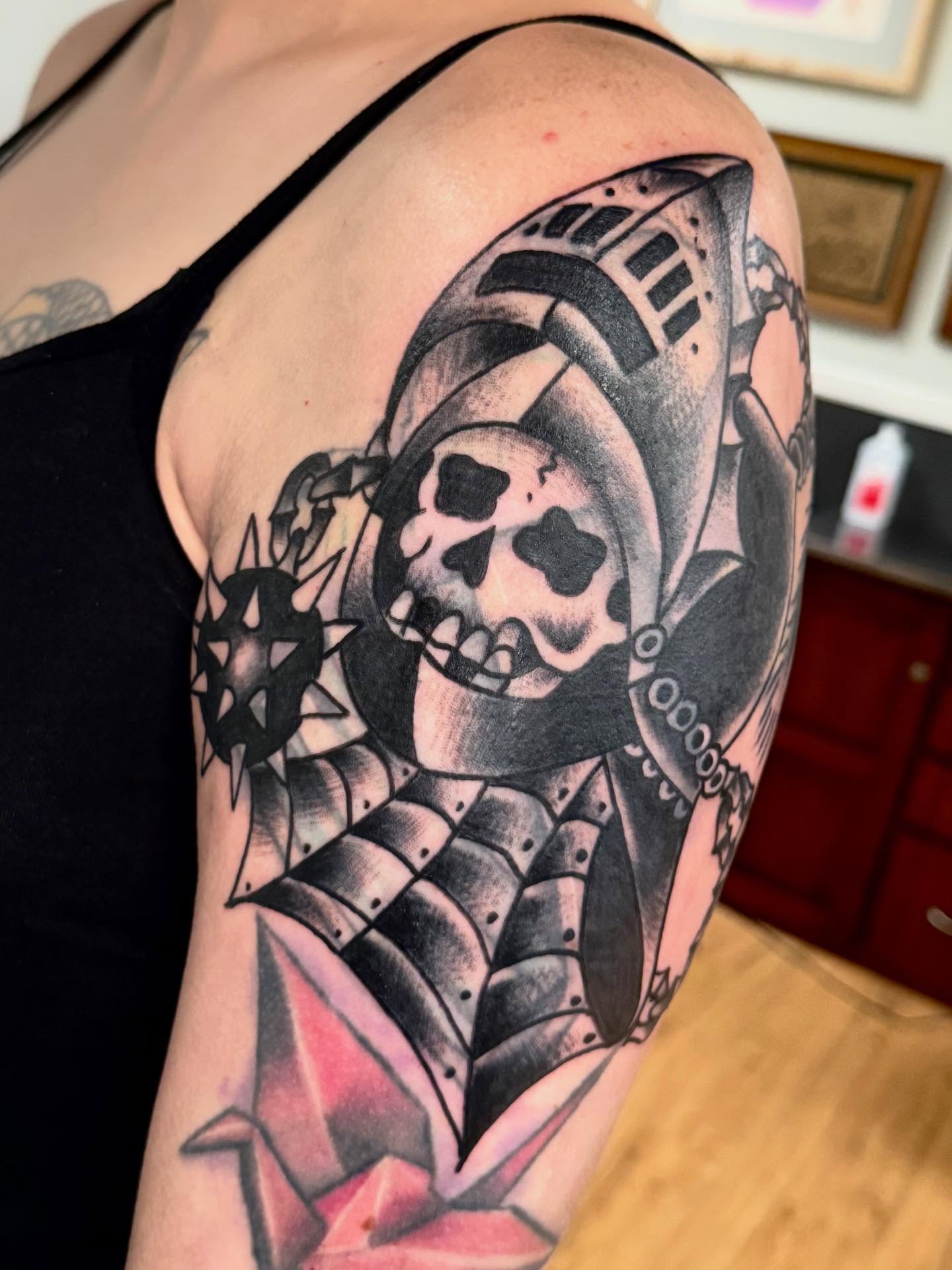 Skull and armor geometric tattoo on the shoulder by Jesse Boss, Nashville, Tennessee