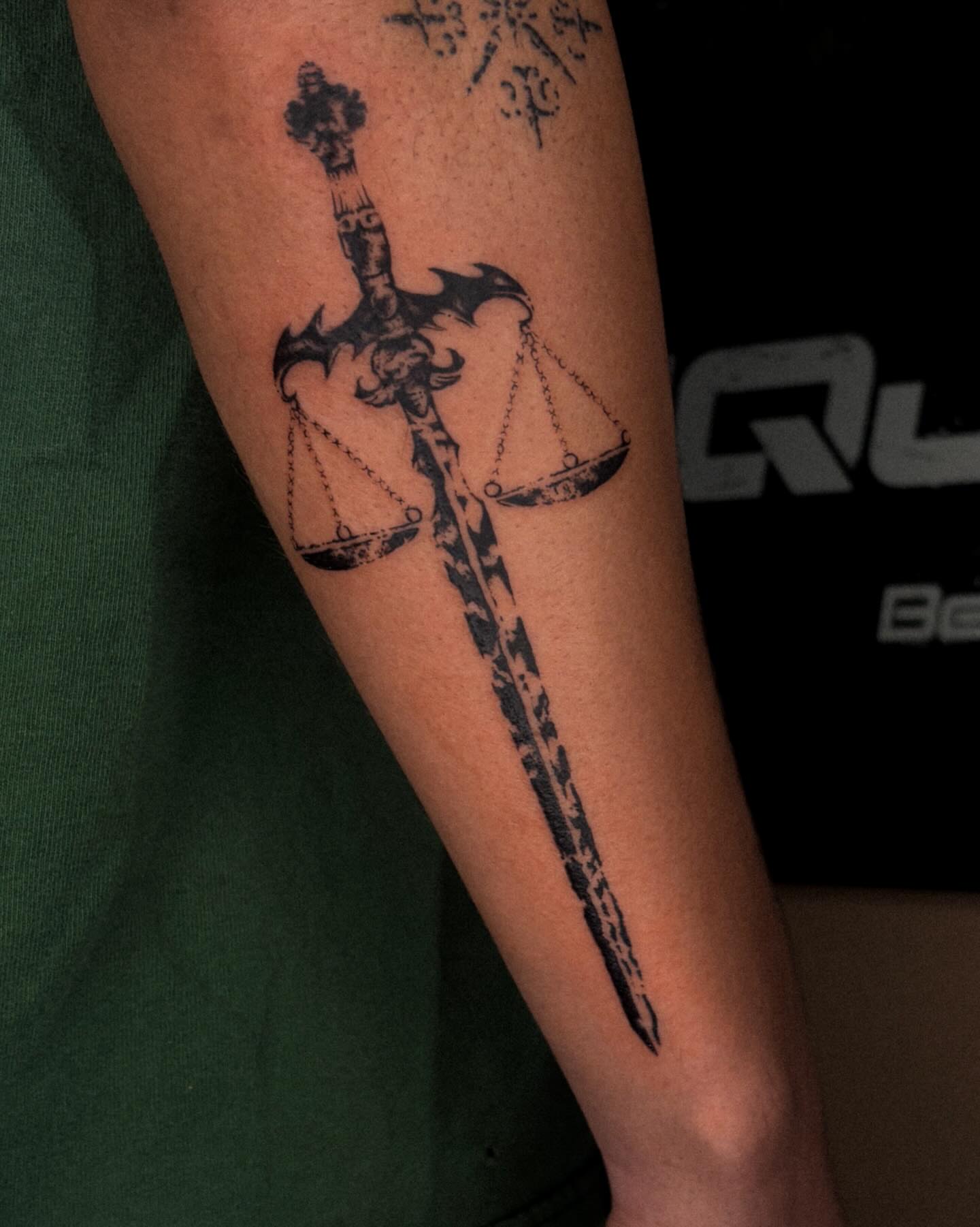 Sword with scales black and grey tattoo on the forearm by ☆ gia