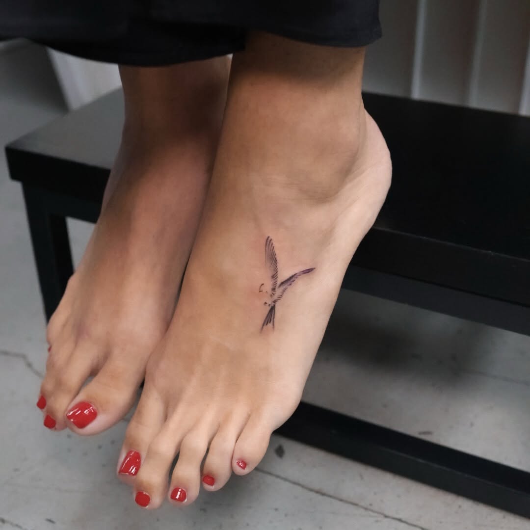 Swallow bird fine line tattoo on the foot by Fine Line, New York, New York
