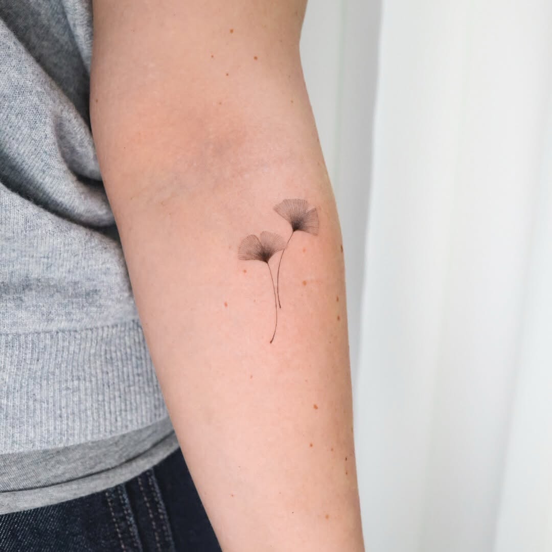 Ginkgo leaves fine line tattoo on the forearm by Fine Line, New York, New York