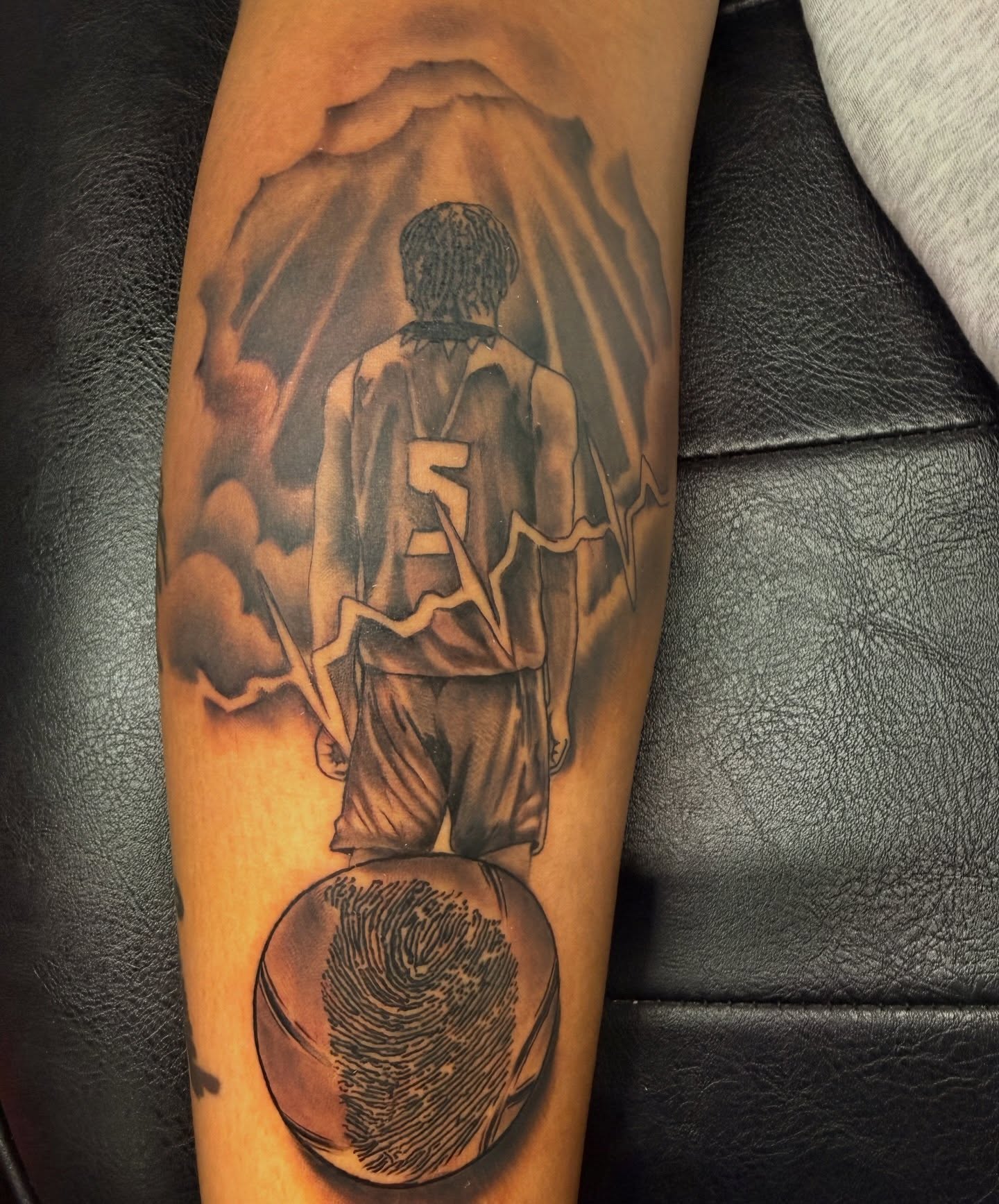 Basketball player realism tattoo on the forearm by Butta