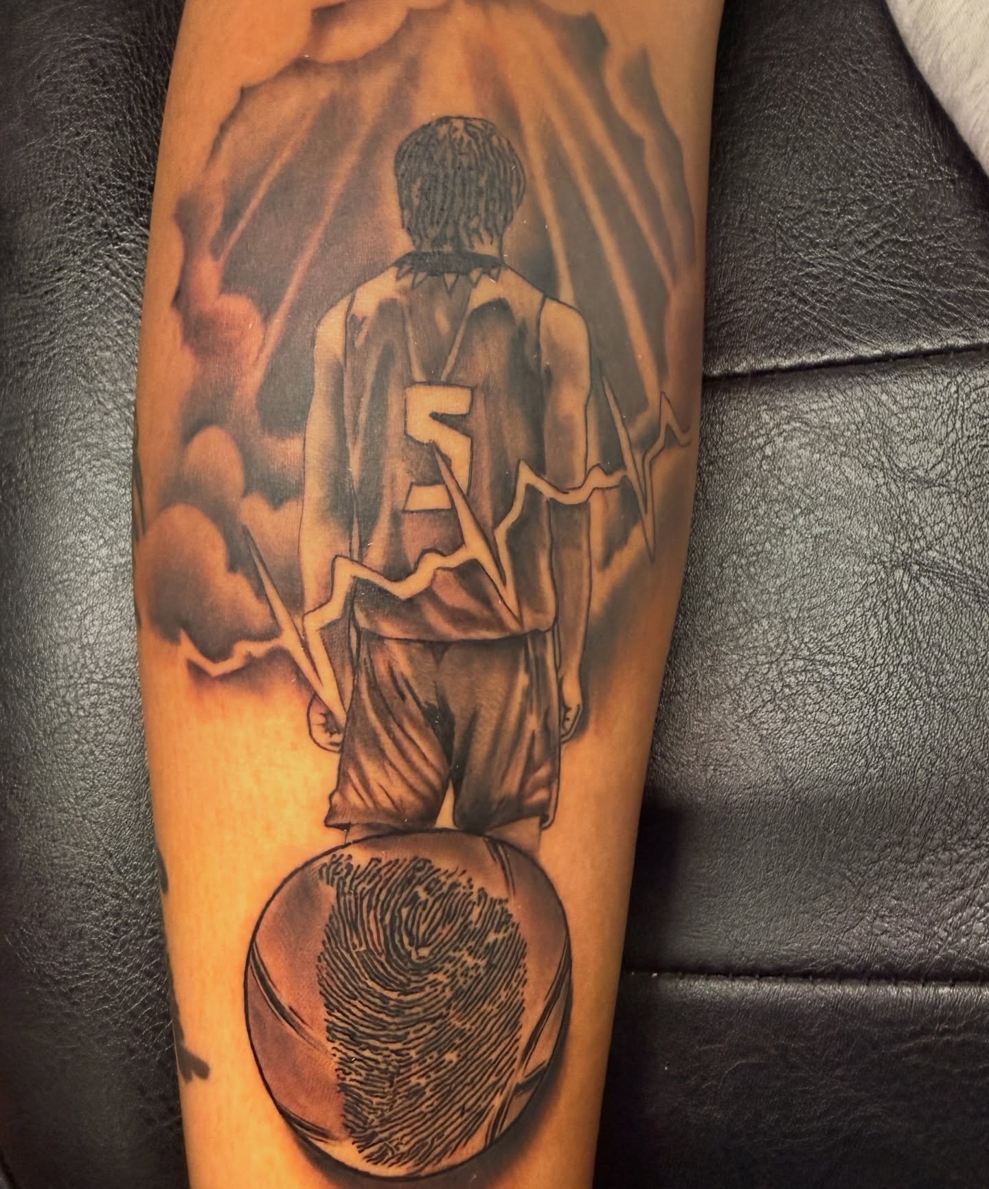 Basketball player realism tattoo on the forearm by Butta