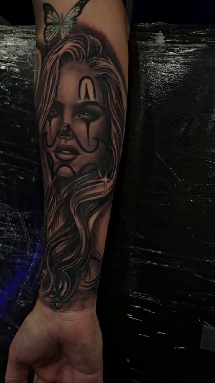 Clown woman with butterfly Chicano tattoo by Richie Garcia, Hesperia, California