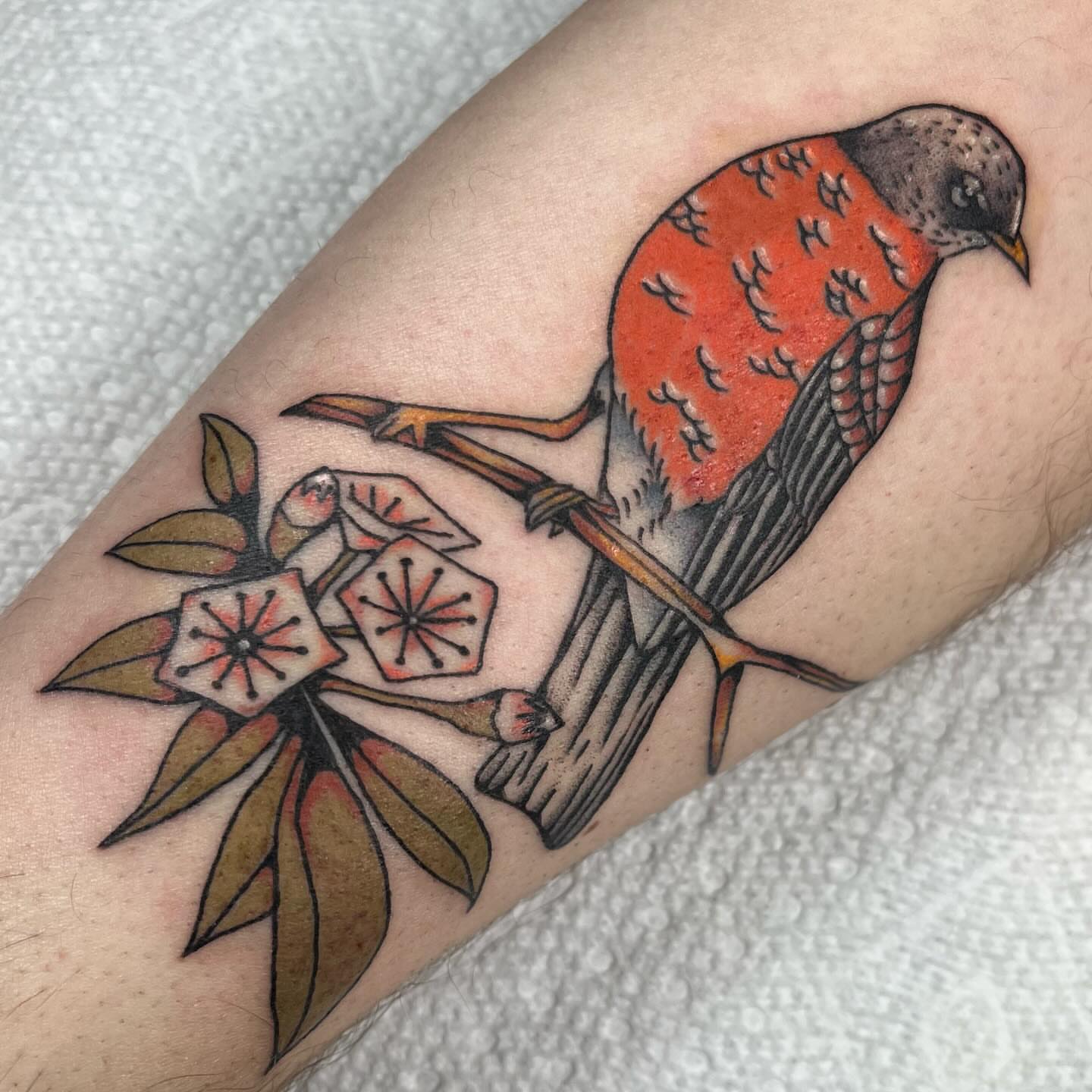 Bird and flowers American traditional tattoo on the forearm by Jennifer Medrano