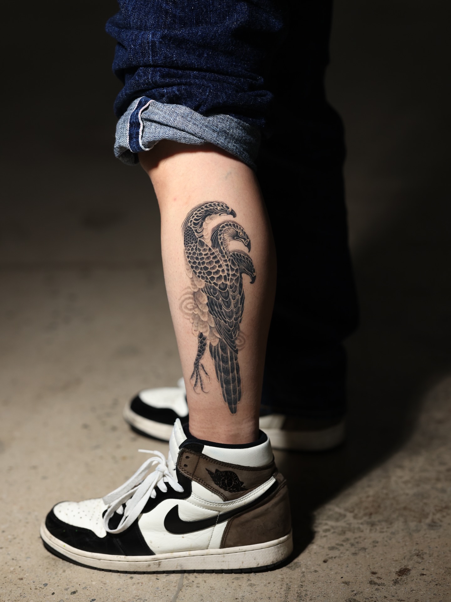 Bird black and grey tattoo on the calf by 𝐆𝐑𝐄𝐄𝐃