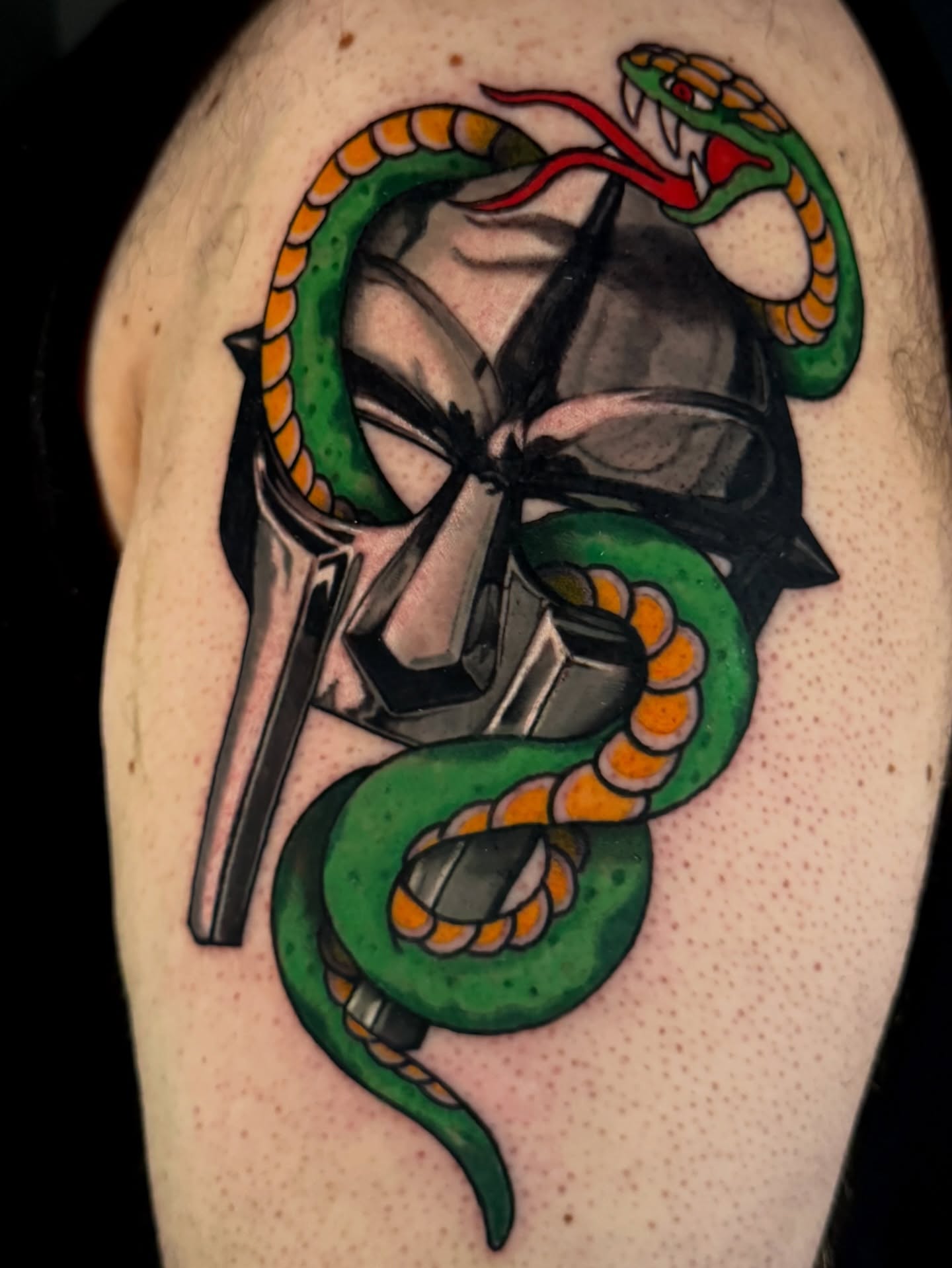 Skull with snake American traditional tattoo on the shoulder by Dallas Tattoo Artist