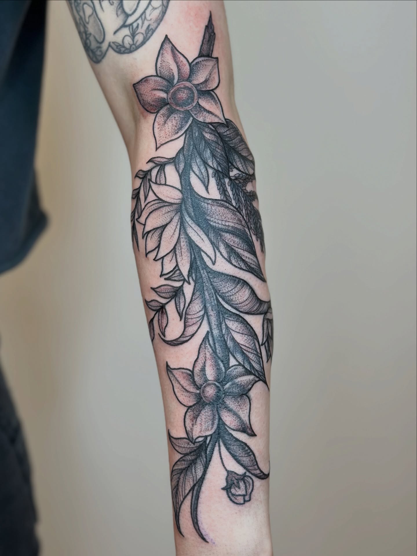 Feather and flowers dotwork tattoo on the forearm by Gabrielle Brodman 🎀 Raleigh-Durham Tattoo