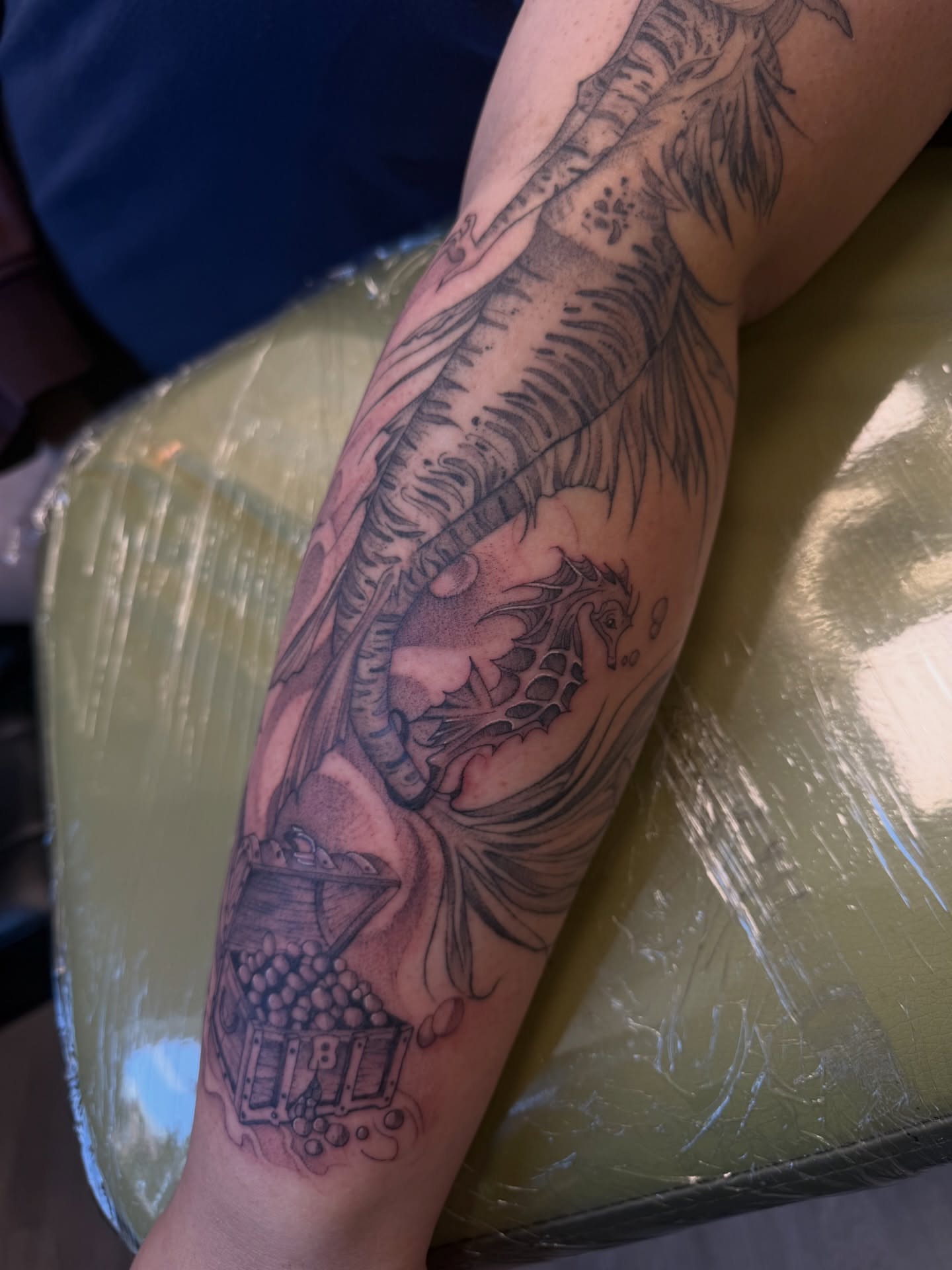 Seahorse and treasure chest realism tattoo on the forearm by ashlyn rene